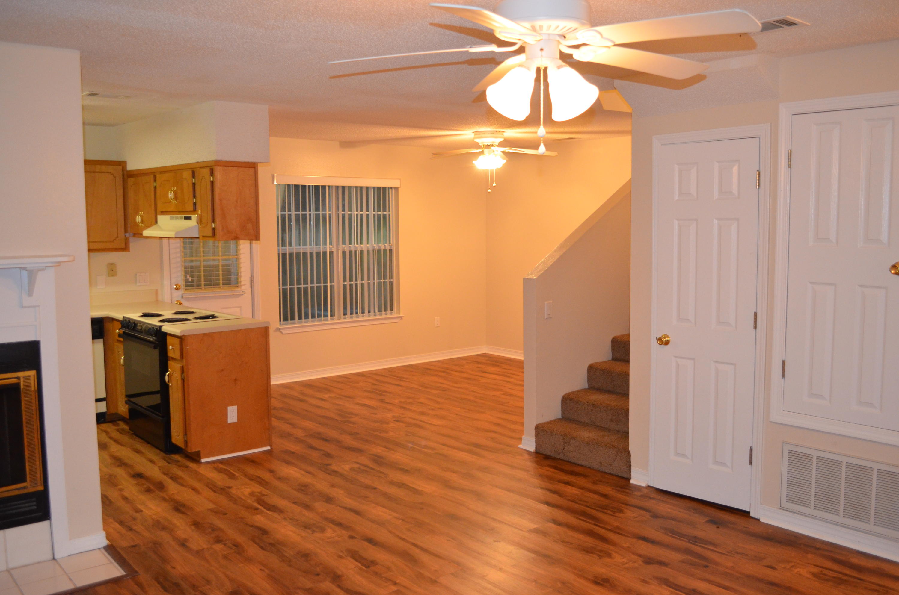 Spacious great room featuring waterproof hardwood flooring throughout the downstairs area, including the bathroom. The living room boasts a fireplace with a mantle for added charm. Upstairs, the bedrooms are carpeted, and both bathrooms feature waterproof flooring for durability. Enjoy the open floor plan downstairs, seamlessly connecting the dining area, kitchen, and living room. Conveniently located in the Northwest part of Fort Walton Beach. Please note, only cats are allowed in this townhouse.  All Coastal Realty Services residents are enrolled in the Resident Benefits Package (RBP) which includes renters insurance, HVAC air filter delivery (for applicable properties) and our best-in-class resident rewards program, and much more! More details upon application.