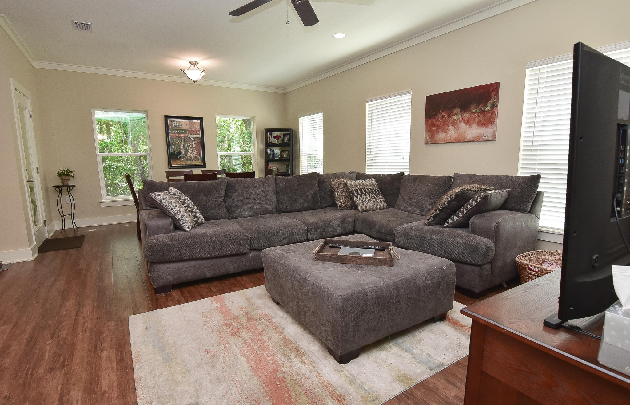 Almost new, this home is open, airy and cozy, from the moment you walk in the door. The beautiful hardwood floors shine and the wide entryway beckons you on in. The living room is large enough for even the biggest sectional and is open to the dining room and kitchen. The kitchen has a great island to work on, beautiful granite and gorgeous dark cabinets, giving the home a luxurious feel. The back of this home is nestled in the trees, which can easily be seen throughout the home thanks to the many windows across the back. Secluded in nature, it gives you the feeling of being in a treehouse, especially when you are enjoying the large covered porch and gazing out at your own private sanctuary. The kids will have a ball making forts and playing in the steam in the low maintenance natural yard. Upstairs,the laundry is handy in the hallway, and the two guest bedrooms share a nice sized full bath. The master has a large walk in closet and the master bath is beautiful with a big tiled walk in shower and a oversized tub for relaxing at the end of the day.
This is a home that you dont want to miss!