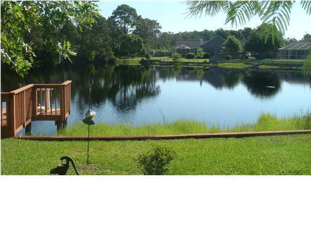 JUST REDUCED. Priced To Sell!!! Rare find beautiful Lakefront home. You wont find a home on the Lake priced this low. Move In ready. Large open family room with valted ceiling and brick fireplace. Hurricane window coverings. Whole house Air purifier. Large maser bedroom with walk-in closet. Fresh paint throughout. Spectacular views of the Lake from spacious enclosed back porch. Tile flooring throughout except two bedrooms have carpeting.Whole house Generac brand Generator. $4500 allowance for carpet, updates or closing costs with full priced offer. Chain link and privacy fenced back yard.