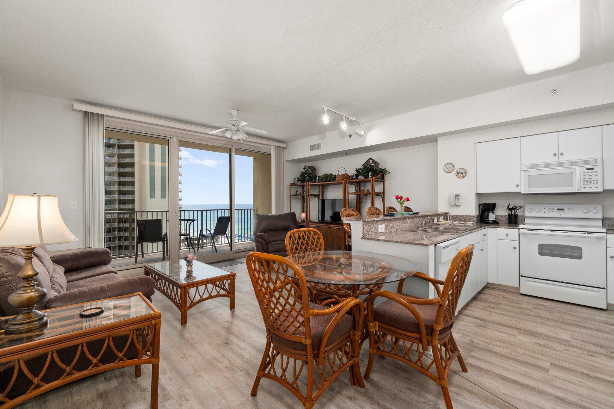 Come live where people dream of vacationing! Bright and welcoming - this condo in the luxurious Shores of Panama is rental ready. This ''A'' unit has an open floor plan kitchen/dining/living room with one bedroom, a bunk room & 2 full bathrooms. With laminate floors throughout the unit, the kitchen features stone counters, white cabinets & appliances, in-unit stackable washer & dryer, coastal decor & stunning views of the emerald coast & lagoon-style pool from the living room and balcony! The unit comes with a dedicated parking spot. Shores of Panama is a 23 story Tuscany style condo of Gulf front luxury accommodations with unparalleled amenities such as 500' Gulf frontage, heated indoor pool, hot tub, sauna and 24 hour security. Schedule a showing today to see your new condo!