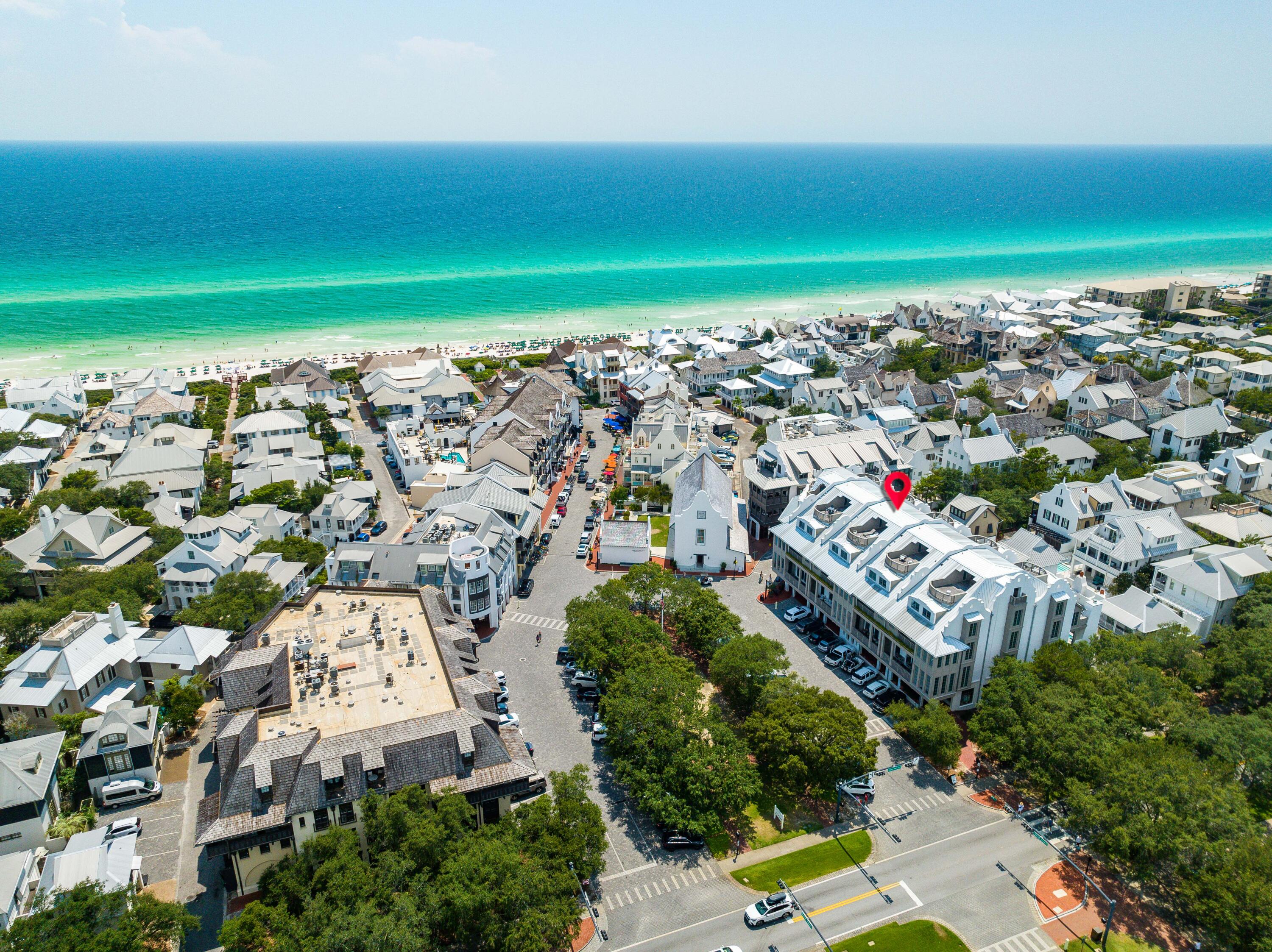 Experience the most upscale residence in Rosemary Beach®. Residence 3 at the Providence spans five levels from the ground floor entry, serviced by its private residential elevator, to the rooftop terrace.
This Breathtaking 6,972 square foot residence boasts 5 large bedrooms with en suite baths, 2 bunk rooms that sleep 4, each with a full bath. The rooftop terrace spans 3,226 sq ft of outdoor entertaining and living space with gulf views east and west as far as you can see. The expertly designed floor plan of this residence allows your family and guests to spread out and enjoy the expansive, second-floor living area that features a huge kitchen, two separate living spaces, a dining room, wet bar and butler's pantry, not to mention the private pool with open fireplace and porch swing. As you enter the residence from the ground floor, you encounter 10' tall French doors, welcoming you into the pristine entry hall. Overhead is a beautiful and timeless chandelier and you are surrounded by gorgeous, white v-groove wood paneled walls and 8" wide plank, wire brushed European white oak flooring beneath your feet. You may choose to ascend to the next floor via the private residential elevator or the staircase with handmade iron railings.

Once on the 2nd floor, you are enveloped by a luxurious mix of white venetian plaster and v-groove wood paneled walls, accentuated by 12' ceilings and massive windows with floor-to ceiling custom draperies. This level is where the family and friends can congregate. Two separate and distinct living rooms and a dining room with fireplace bookend the massive kitchen. The kitchen island alone is 18' long, featuring a gorgeous, waterfall Taj Mahal Quartzite countertop, two porcelain Shaw's farm sinks, two Cove dishwashers, a Wolf 24" microwave drawer and seating for seven. The kitchen cabinetry is custom made by Karpaty Cabinets in Atlanta, and the designer used their high-end cabinetry throughout the entire residence. Built into the cabinetry, a 36" SUB-ZERO over-under refrigerator and freezer perfectly serves the needs and design of the kitchen. The crown jewel of the chef's kitchen is arguably the 49" Wolf dual fuel range with 6 burners and infrared griddle, and two ovens measuring 18" and 30". The kitchen is further serviced by a butler's pantry behind the range that features additional shelving space, an additional porcelain Shaw's farm sink and Cove dishwasher. The butler's pantry is also plumbed for a second refrigerator and oven or other appliances if the new owner so desires. Opposite the butler's pantry and on the other side of the island, you will find a half bath with gorgeous marble counter and Karpaty cabinetry.

The dining room and living room on the far end of the 2nd floor are accompanied by a wet bar with beautiful dark painted Karpaty cabinetry, a hammered brass drop-in sink by Newport Brass with freshwater filtration system, a 15" SUB-ZERO ice maker, and a 24" SUB-ZERO beverage center. A porch that spans the width of the living room overlooks the vibrant South Barrett Square of Rosemary Beach. As you make your way back through the kitchen, you see the inviting and private pool and patio through the 10' tall windows. The pool deck is covered with Flagstone pavers and offers ample seating and lounging area on all sides of the pool, as well as a fireplace for those cooler nights in the winter.

Ascending to the 3rd floor, you find a bunk room and accompanying bathroom, a large guest bedroom with en suite bath, a laundry room with 2 sets of 27" LG washer/dryer units, and the massive master bedroom suite. The bunk room provides 4 twin bunk beds and a corner nook for reading, playing video games or watching movies. The guest bedroom around the corner is large with a king bed, a small, corner space for a desk and porch access.

The master bedroom suite is luxury at its finest. Boasting two master baths and closets, as well as a porch spanning the length of the bedroom, you will not want to leave this oasis. Carrara marble tile is found in both baths from floor to ceiling. The beautifully stunning Karpaty cabinets in each bath are unique and elegant, offering plenty of space to spread out. The dual walk-in closets provide ample space for full-time living or the week-long dream beach vacation.

The 4th floor is where you find 3 additional guest bedrooms with walk-in closets and en suite baths, a large den for relaxing and watching television, as well as the second bunk room with 4 twin bunk beds. From this floor, you can access the rooftop terrace by riding the elevator or ascending the spiral staircase off the den. Once you reach the rooftop, you will understand the concept of "elevated living" in Rosemary Beach. With its own half bath, mini-wet bar with sink, massive space for seating and congregating, and expansive views of the Gulf from east to west, you will spend countless hours watching sunrises and sunsets from the rooftop while entertaining friends and guests