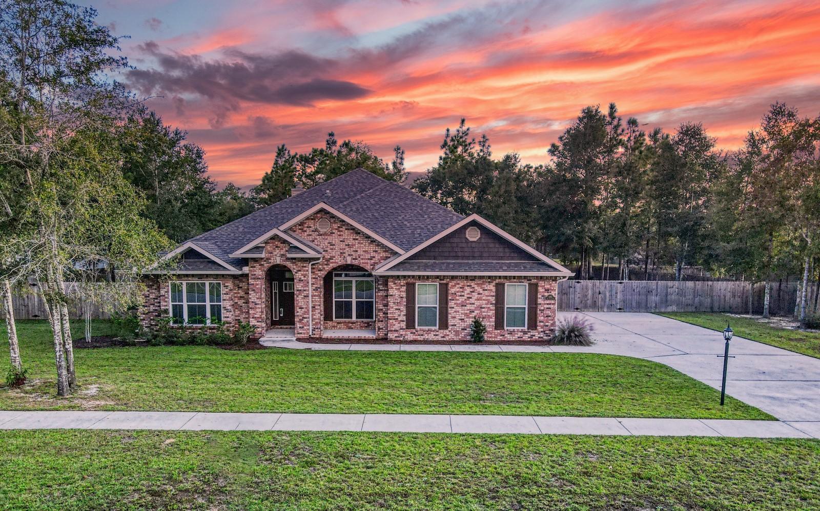 Imagine a Family-sized 1-story transitional style home set on a huge lot in The popular Gated community of Colony Ridge !!  The open design  of the living/kitchen/breakfast nook area allows you to be in the kitchen and yet still be apart of what is happening in the living room. The chef-friendly kitchen is spacious enough for the entire family to help cook and bake desserts for the holiday season. Sizable bedrooms for everyone to enjoy their own space. along with a well-designed  Master bedroom/bathroom showcasing  a roomy  shower and a private
 inviting soaking tub makes you feel like you have your own private spa getaway. In the heart of the home is an enchanting raw brick wood burning fireplace with a solid wood stained mantel. Enjoy your morning coffee relaxing on the screened porch overlooking the Ultra-spacious Family-friendly backyard.

In close proximity to supermarkets, shopping and entertainment.. Easily accessible to Schools, Military bases, Beach and Major Interstate.