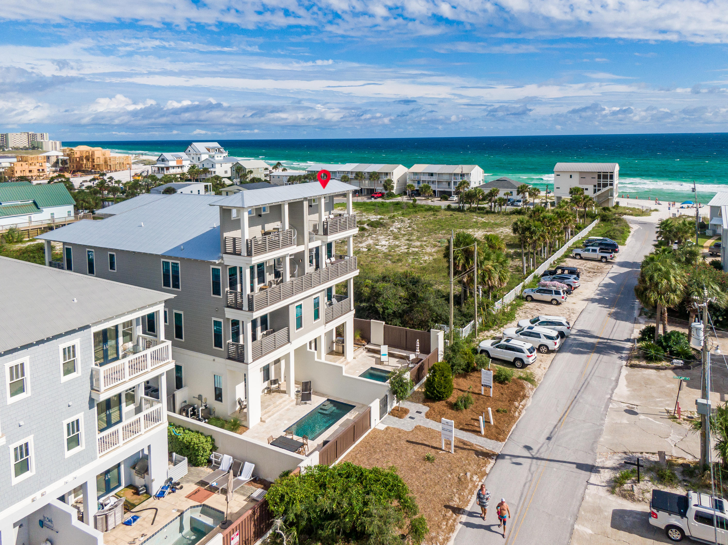 Impeccable style meets incredible Gulf views at this 5BR/5BA luxury southside duplex with private pool located mere steps from the beach in the flourishing and desirable Inlet Beach community. This property has been meticulously designed to maximize enjoyment of views with a bright and airy third level living and dining area that opens to a covered balcony with breathtaking Gulf vistas and a spiral staircase that leads to an observation tower perfect for soaking up the sunset. White shiplap walls contrast with wood floors while modern lighting creates a soothing coastal vibe throughout. The fully equipped kitchen features ample floor-to-ceiling cabinetry, marble countertops, a breakfast bar, and stainless Thermador appliances including a separate wine refrigerator. There is so much more! A guest room with ensuite bath is also located on this level. On the second floor, find dual master suites with spa-like ensuites and private porches, and a bunk room with built-in bunks and a private bath. The first level offers a secondary living area with a Murphy Bed that leads to the courtyard, a second full kitchen and a full bathroom. The heated and cooled garage is currently configured as a game room/flex space that seamlessly connects to the first level living space. The walled courtyard is a cozy outdoor retreat centered around the heated pool with covered and open spaces to relax and grill. There are five covered porches throughout the home, each offering Gulf views. This property is ideal for a vacation rental or as a private sanctuary. The easternmost 30A community, Inlet Beach is blossoming with quality new development, restaurants, shops, and there is public access just steps away.
This is the Best at the Beach!