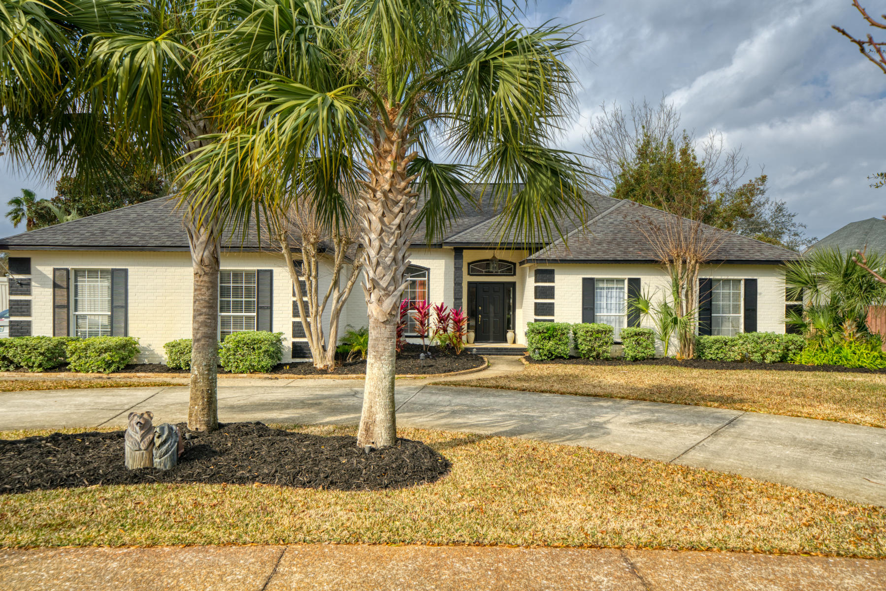 Desirable Indian Bayou Home features Circular Drive and Palm Trees add to curb appeal of Split floor plan Ranch.  Enter foyer and find open dining area to left.  Refreshing Swimming Pool with Screened Lanai, cozy fire pit, 8' tall fence with double gate leading to paver area for a boat trailer, and shed all located in private back yard. Double sets of French doors flank the granite-tiled fireplace and lead from living room to Florida room. Updated Eat-In kitchen boast stainless appliances, wood counters at Breakfast Bar and ''slate'' tile flooring.  Hardwood oak flooring throughout main living area and newer carpet in bedrooms. All 3 Baths are Full Baths and Renovated! Master bath features beautiful walk-in shower, large walk-in closet, double vanities and extra linen closet.