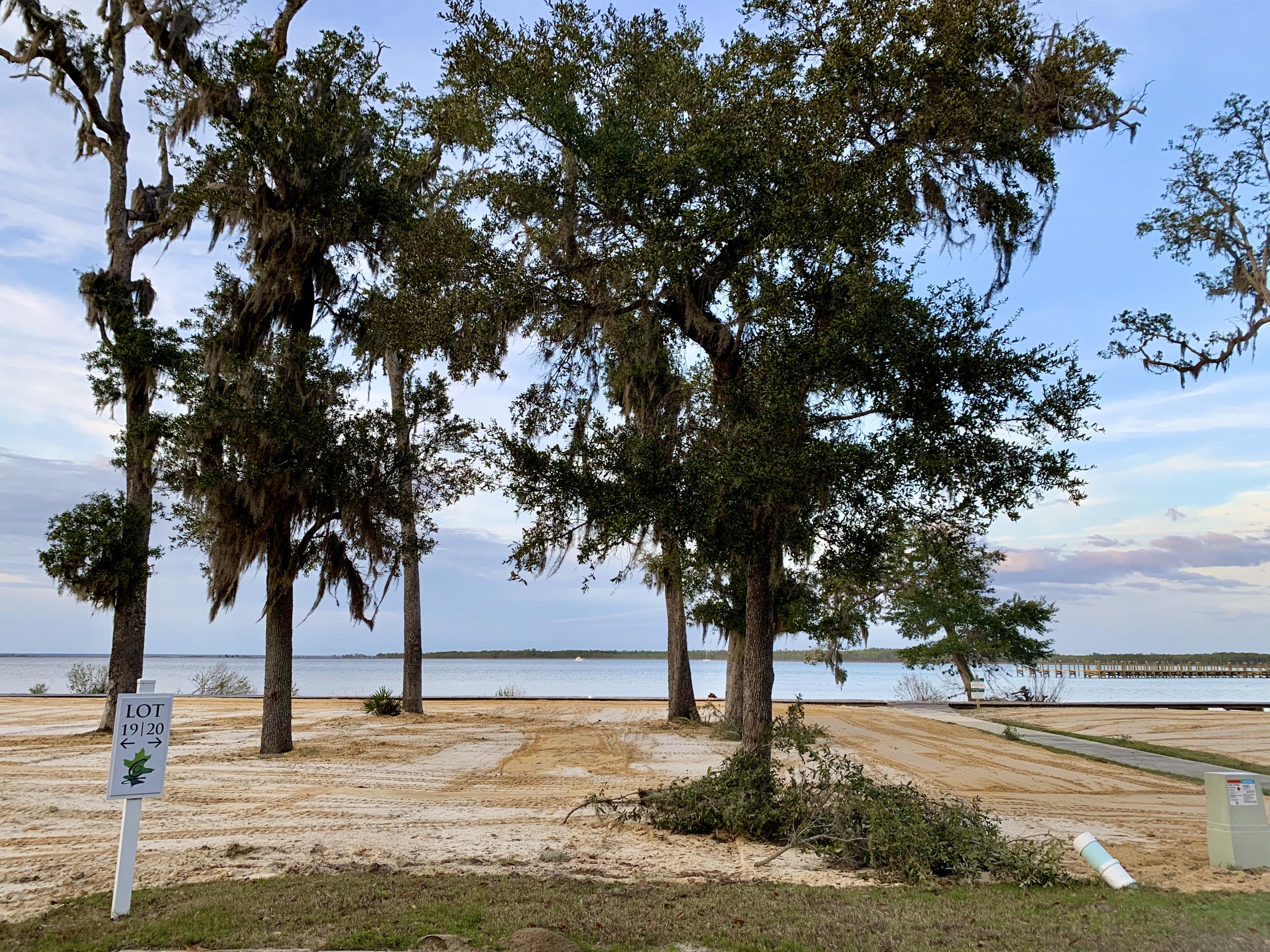 Lot 19 is a premium bay front homesite situated on a quiet cul-de-sac and tucked away with only native vegetation and the calm waters of Hogtown Bayou in sight. Churchill Oaks offers a lifestyle of elegance and appreciation of nature. Once inside the stately gated entrance, magnificent coastal homes accentuate southern architecture under a canopy of old oak trees. The 40-acre community is comprised of 87 homesites and some of the best amenities in South Walton. The latest amenity to the community is a brand-new private deep water marina. The marina project includes 36 private boat slips, paddle board storage decks, a fish cleaning station, shoreline stabilization + more! Please verify with on-site agent the total New Buyer fees due at closing.