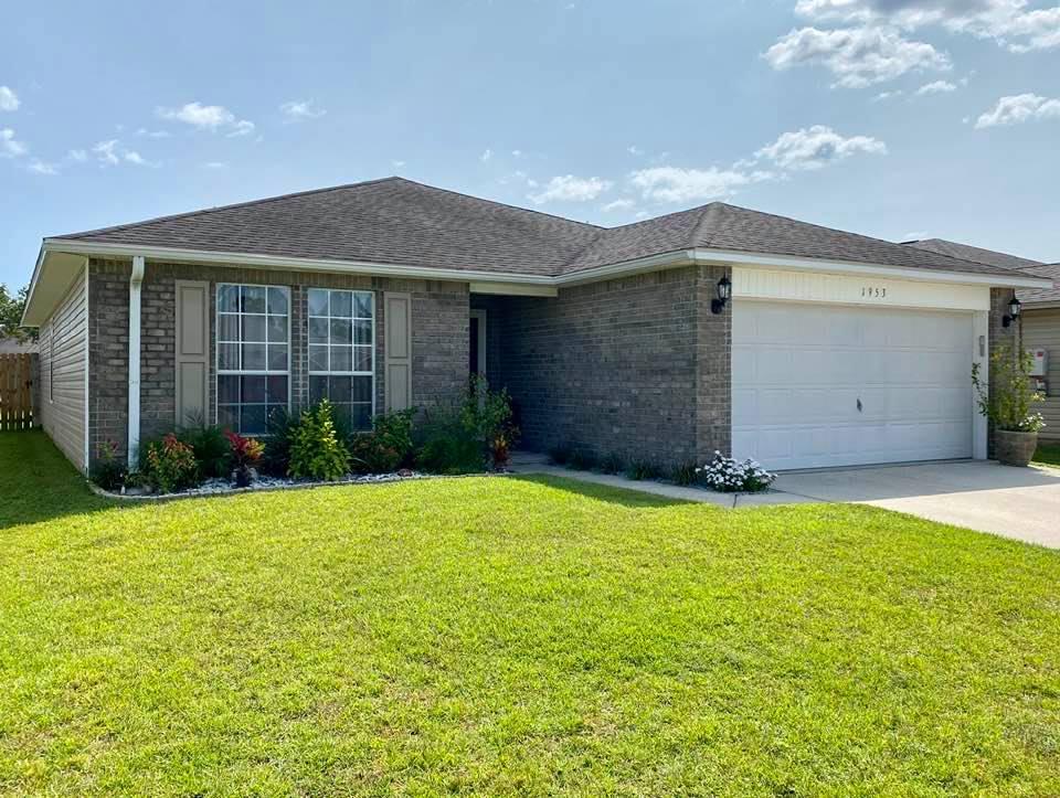 This well-kept Navarre home is better than new! 3 bd / 2 ba home, spacious living room with vaulted ceiling, kitchen with all stainless steel appliances, breakfast bar, updated cabinets and modern hardware. Upgraded light fixtures and ceilings fans throughout the home. Luxury vinyl plank flooring in all interior rooms except the master bedroom which features newer plush carpet. Sliding glass doors in the dining area lead to a screened in back porch, back patio and large yard with privacy fence.  Sprinkler system with new pump. Zoned for highly sought after schools, just 14 miles from Hurlburt Field, and most importantly – it's only about 3.5 miles away from the sugar sand beaches and emerald waters of Navarre Beach. Don't hesitate on this one, it won't last long!