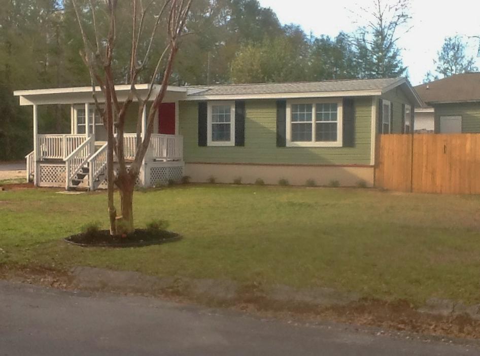 Adorable Florida Cottage with SO many possibilities! Zoned both Residential Single Family AND R2, for possible multi-family use. Sitting upon one of the largest lots on the block, this quaint home has been remodeled. Used as a rental, but perfect for full time owner. Cypress siding, privacy fenced yard with lawn pump and sprinkler system installed. Home has been overhauled with new windows, roof, A/C, sheet rock, copper wiring, plumbing, new kitchen and Laundry room added. Sit out on your covered front porch, or BBQ on the deck. A matching yard building holds your lawn equipment, etc. A sweet opportunity that rarely comes along. Home is being sold, ''As Is,'' as has been used only as a rental. Hurry and let your imagination soar!