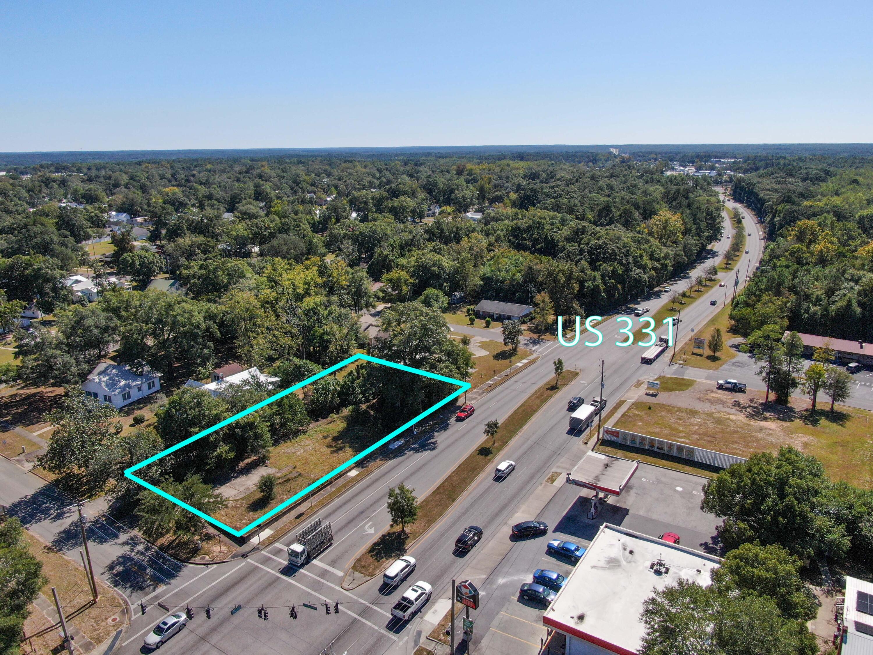 Gateway corner .39 Acre Lot fronting Hwy 331S in absolutely fantastic location, leading to Lake DeFuniak and downtown. Located within the historic district and currently zoned multi-family. 180 feet of Hwy 331S frontage and 21,500 daily traffic count. Previously served as attorney's office. The City of DeFuniak Springs Planning Department can direct you best for any zoning changes, etc.  Endless opportunities here - don't miss this golden opportunity today.