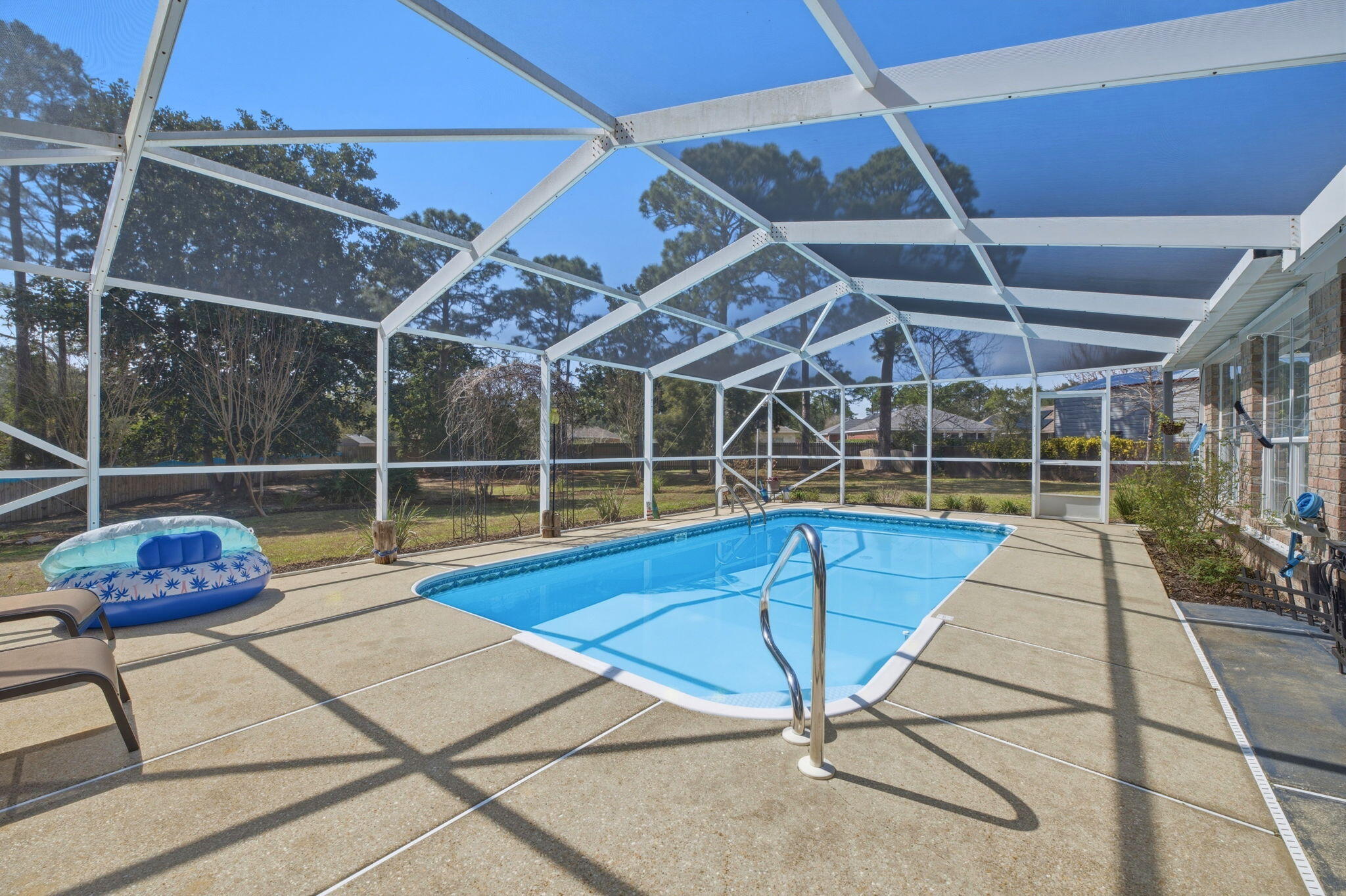 Welcome to your private coastal retreat in the desirable Sound Retreat neighborhood--perfectly tucked away on a quiet cul-de-sac on the charming street of Nautilus Drive. If you love the Emerald Coast lifestyle, this location alone will capture your heart.

More DRONE photos coming soon! 

Residents of Sound Retreat enjoy water access for boating, kayaking, fishing, and soaking in the refreshing coastal breeze, making it easy to experience the very best of Florida living just moments from your front door. Walking your dog and riding bikes. This is a truly beautiful Sound side neighborhood of Navarre. This beautiful brick pool home is in remarkable condition and offers both comfort and peace of mind. The roof was replaced just two years ago, an important upgrade that many buyers appreciate when securing homeowner's insurance.

Step outside and you'll discover your own backyard oasis. The home features a screened-in pool enclosure, allowing you to enjoy swimming and relaxing year-round while keeping the space protected. The fully fenced backyard sits on an impressive .56-acre homesite, providing privacy, room to spread out, and mature landscaping that surrounds the property with natural beauty. With no neighbors directly behind you, the setting feels peaceful and secluded.

Inside, the home offers four full bedrooms and two bathrooms, giving you flexibility for extended family, guests, or dedicated office space. The layout spans just under 2,200 square feet and reflects a classic traditional design that feels both spacious and welcoming.

A long, deep driveway provides plenty of parking in addition to the two-car garage--perfect for visitors, extra vehicles, or recreational toys for the water.

The sellers are offering a flexible closing date to accommodate buyers' needs.

Showings require 2-3 hours notice. Be sure to watch for upcoming open house dates and times online--this is a home you'll want to experience in person.

Come discover why life in Sound Retreat on Nautilus Drive is such a special place to call home.
Water Heater is 13 years old. Could need replacement depending on insurance companies requirements. HVAC is 18 years old and maintained. Owners are willing to provide a home warranty at closing.