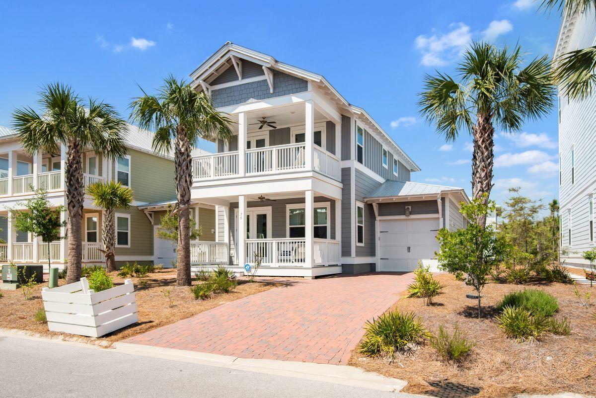 An elegant coastal retreat with modern finishes located south of 30A in the community of Prominence.  Ideal for full-time living or a rental investment, this beach home is fully-furnished and move-in ready.  Open and spacious, natural light flows through this home with its many windows, tall ceilings, and 8-foot doors.  Prepare meals in an expansive gourmet kitchen with a large breakfast bar, stainless steel appliances, and quartz countertops. This four bedroom home offers the owner's suites on the first level with three guest rooms upstairs. Two guest bedrooms on the second level share a covered porch.  Additional outdoor entertaining spaces can be found on the first level with its porch and a deck with plenty of room for grilling, dining, and sunbathing. Just steps from The Hub on 30A, walk to popular boutiques and restaurants, and enjoy local live music. Additional amenities include a nearby resort-style community pool and a fitness center.  Easily explore 30A's many shopping, dining, entertainment, and infamous beach options at your leisure.
