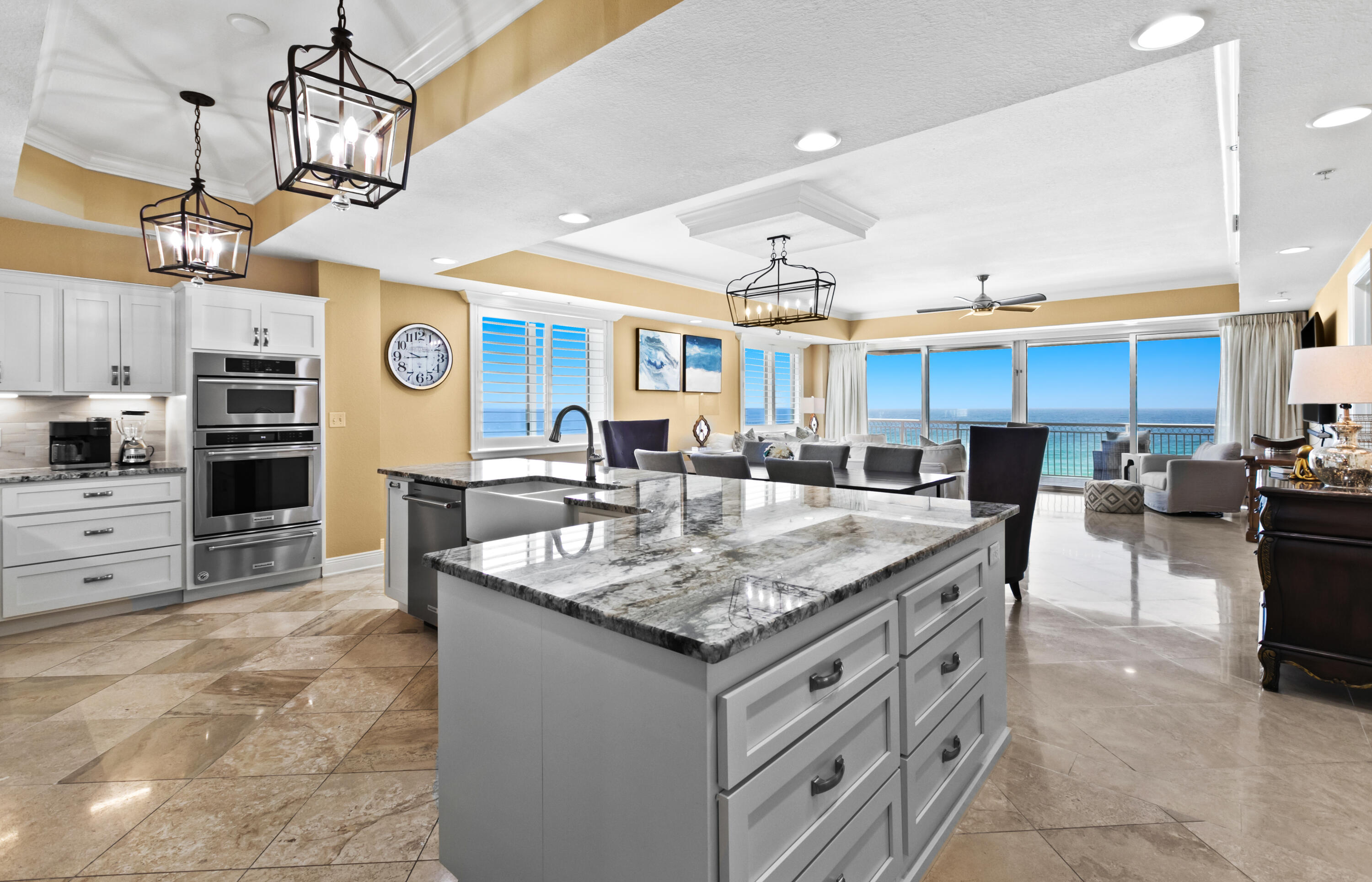 Offered at $3,100,000 this one story 5 bedroom east end beachfront penthouse boasts panoramic views of water and sand. Wrap around balcony encompasses the entire back plus balcony sitting areas off the guest bedrooms. Beautiful color palette throughout. Furnished. The oversized primary suite steps out onto the covered balcony and features a private bath and two walk in closets.  Recent remodel of the kitchen with new cabinets, lighting, granite countertops, marble backsplash. Top of the line appliances; built-in refrigerator, gas range with gas oven plus electric wall oven/microwave & warming drawer. Huge island for entertaining. HVAC replaced in 2023 with Halo system & dehumidifier. Wet bar w/ice machine and second refrigerator. Convenient deeded 5x8 storage cage on same level as unit. Fitness center on 2nd level. If you are looking for your forever beach home, look no further. The floorplan is ideal with two living areas and over 37 feet wide end to end. 500 +/- square feet of outdoor living wrap around balconies. Located in the quiet west end of Scenic 98 surrounded by high end properties. Securely fenced and gated for the utmost in privacy and security and 360 feet of deeded private beach situated on 1.34 acres. Only 20 units total with 4 condominiums per floor. With parking underneath the building, this is 5th floor level and towers over your neighbors with panoramic views of the spectacular sunrises and sunsets.