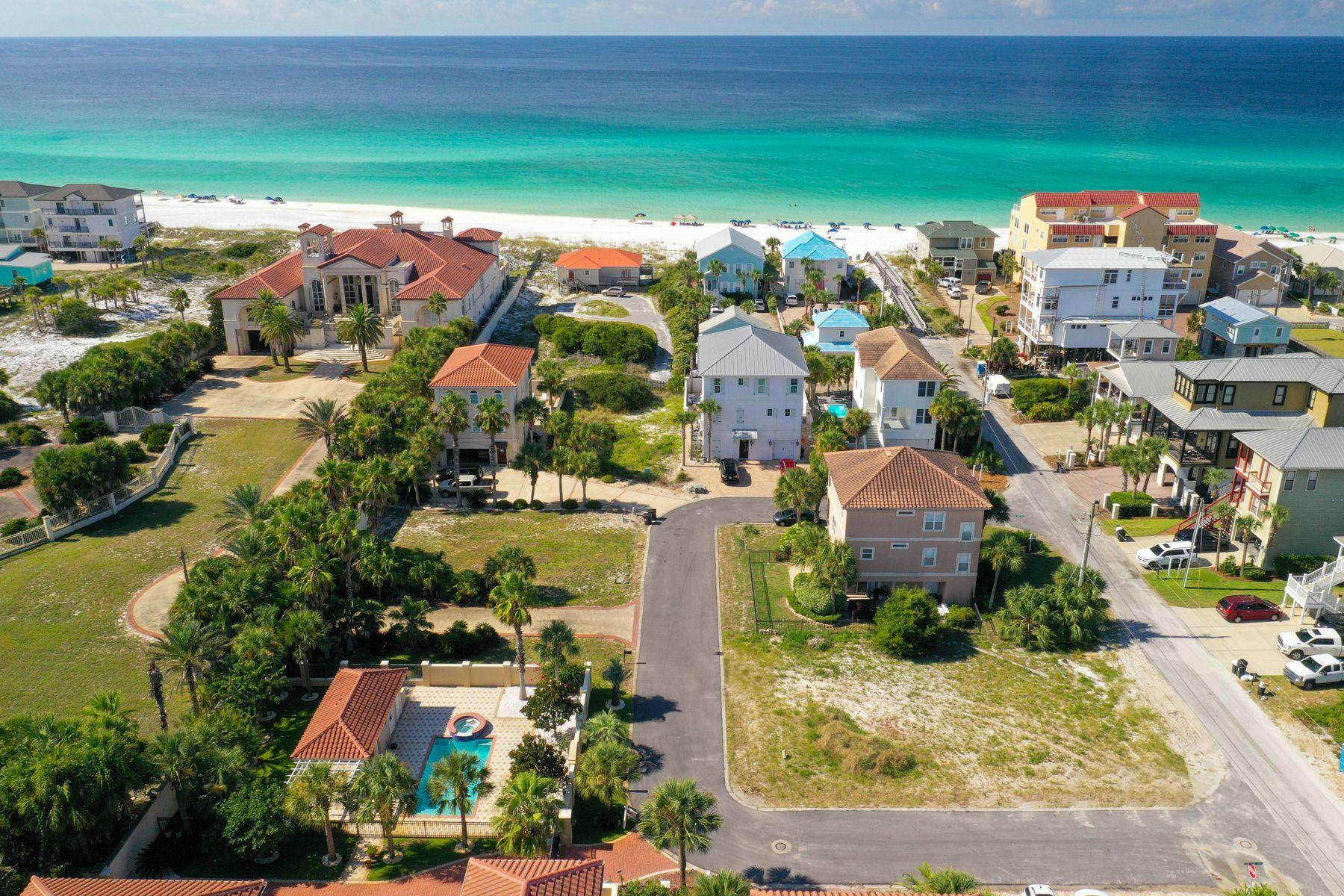 Here is an ideal homesite close to everything fun and only steps from the beach, yet with a little nest element tucked into native vegetation. Since there's a lot going on in Miramar Beach, but it is always the magnificent snow white sandy beaches and stunning emerald green Gulf of Mexico waters that draw people from around the world. This palm tree studded lot nestled about three lots back from the beachfront is certain to have grains of beach sand and gulf front breezes finding their way to the charming property.
Living here represents a glorious kind of lifestyle for abundant water sports, fresh produce at the farmer's market, art galleries and boutiques, and world class restaurants. Bring those dreams along with your creative ideas, favorite colors and personal style preferences to reality. While you can enjoy golf, fishing and ecosploring, the Emerald Coast a few steps from your new front porch will draw you day after day to its serenity and beauty. Your beach house here marks a new season in the rest of your life; one filled with warmth and excitement in a home built with love and imagination.