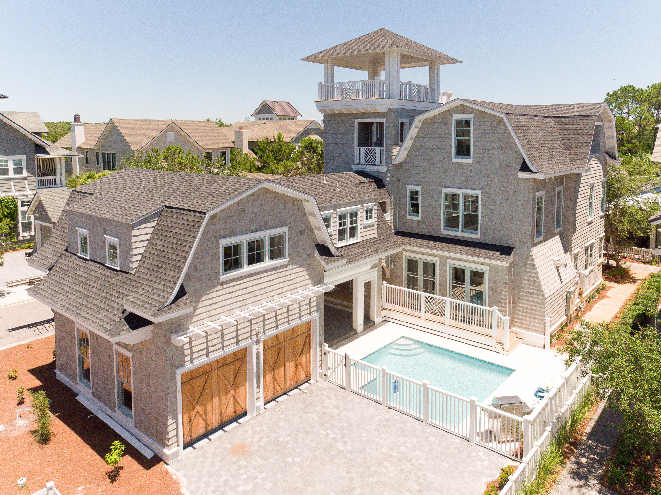 Construction complete! This coastal inspiration captures the essence of WaterSound Beach perfectly with its inviting floor plan and extraordinary use of outdoor living spaces that complement the dramatic interiors. Immediately, you will be drawn to the stunning inner courtyard which boasts a private pool and large covered porch, designed to maximize the indoor/outdoor connection of the home. Inside, the interior spaces are well-proportioned and include first class finishes throughout such as rough hewn oak floors, custom wood mouldings, Circa lighting, Wolfe and Sub Zero appliances, Tile by Walker Zanger, beautiful marble and granite counter tops, custom cabinetry through out and so much more. In addition to the two car garage is a luxurious carriage house with all the upgrades! With two generously proportioned master suites, one in a separate carriage house, privacy and space are to be ensured.  In addition, this home offers multiple living and entertaining areas in an open, family friendly interior design.  The third floor flex space offers a tremendous amount of space, perfect for the kids!  All of this combined, maintains the emphasis on a relaxed, beach lifestyle.  A fourth floor tower completes the homes allure by maximizing the benefits of this location with glorious views towards the Gulf.  This home is a testimony to the enduring quality of superb design.  If the best of everything is your way of life, you've just found your new coastal sanctuary.