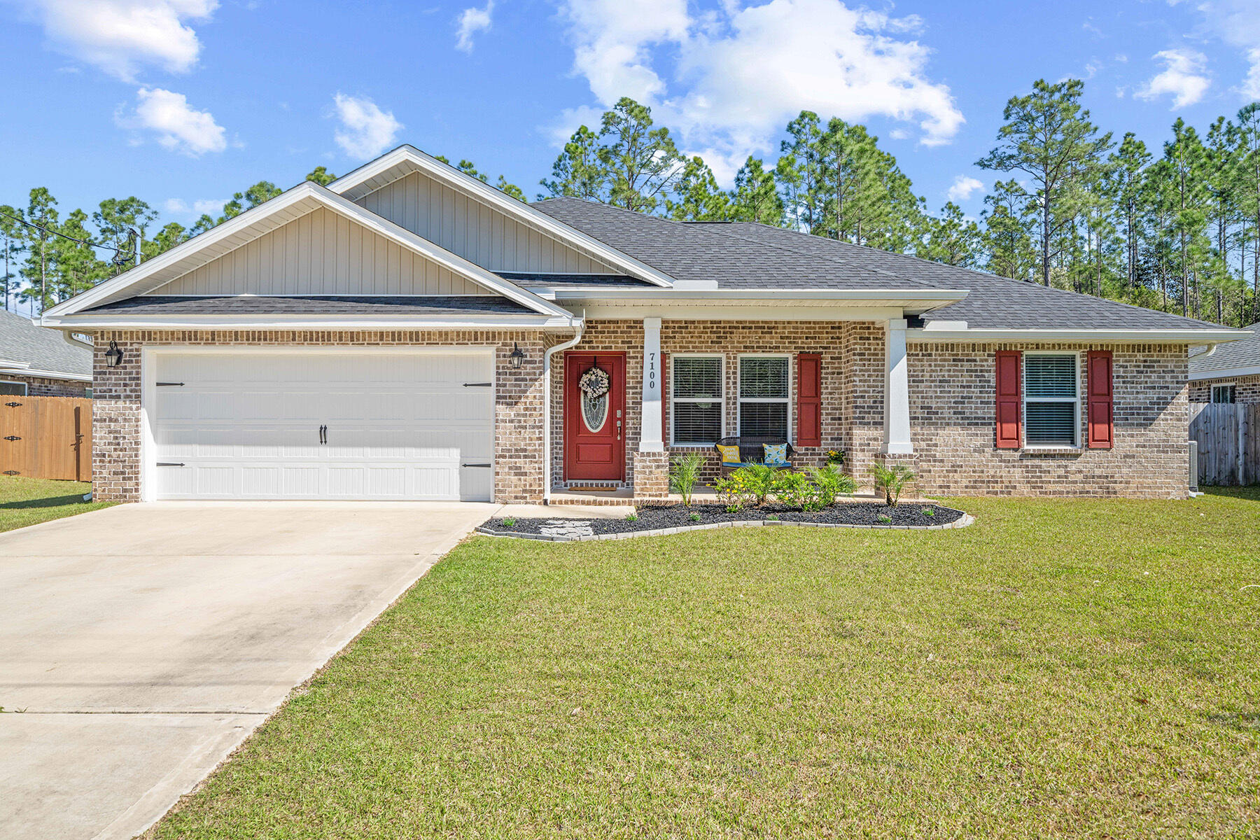 Looking for a beautiful with an Assumable VA loan at unbelievable 2.75% rate? Better than new! This home has been immaculately maintained and is just 3 years old. Built by Herbst Homes which means it included lots of extras and it is more like a semi-custom home. Definitely not a production builder home. Solar Panels recently installed approx $26,000.00 It is a 11.445Kw System (29 Panels) Seller will pay off at closing! Electric bill under $25/mo. What a great savings for new buyer! Great curb appeal and sitting on just under a ½ acre lot at .48. Step inside and you will begin to notice the upgraded features. Large living room with vaulted ceiling, ceiling fan with light and additional recessed lighting. Luxury vinyl flooring in light gray and perfect color paint add to all the natural light. Floor plan is open with the sharp white kitchen in view from your living area. Kitchen features a large island with breakfast bar pendant lights and granite counters. Stainless appliance package and hardware on the cabinets. Staggered cabinet heights and crown molding dress up the kitchen nicely too. Large dining area just off to the side with chandelier. Indoor laundry room also has lots of pantry shelving for food and small appliance storage. Glass French door leads you out to the back patio! The primary bedroom has a lighted trey ceiling, ceiling fan with light, and recessed lighting. Ensuite bath features granite double vanity, linen closet, framed mirrors, light fixtures, tiled shower with glass tile accents and shampoo niche. Someone will be enjoying the custom closet features in the primary walk in! So many great details in this home included. Nice size additional bedrooms have ceiling fans with lights as well. Arched doorway leads to the bedroom hallway is a nice touch. Guest bath with granite counters, framed mirror and nice size vanity. The exterior was not left out when it came to upgrades either. Large wooded lot can be cleared but does include a wood privacy fence currently. Gutters on the home and sprinkler system too. Nicely landscaped. Backyard pergola, patio set and umbrella stay for you to enjoy this private yard. Endeaver model kids playset from backyard discovery remains too.New HVAC system installed 2023. No HOA which means no HOA fees! Front door features a combo lock and 2 car garage has a smart garage opener feature. Ring doorbell with stay too for buyers convenience. This home is truly move in ready! Great location minutes from Hurlburt, beaches, and restaurants.