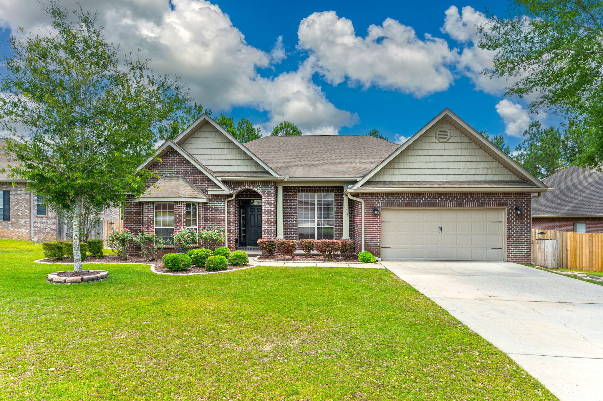 Welcome to this lovely all-brick home, featuring a smart and truly functional layout situated at the back of South Crestview's popular Rolling Ridge subdivision! A gracious front porch welcomes you into a bright foyer. Immediately notice newer LVP flooring throughout the home - NO CARPET! To the left behind double doors, find a flexible room with cathedral ceilings and a shiplap feature wall that could easily be used as a 4th bedroom, office, or playroom. The heart of the home consists of a formal dining room, spacious living room with cathedral ceiling, generous kitchen with granite counters, and a casual dining space. On one side of the living room, find two large additional bedrooms, a full bathroom with granite counter top, and a dedicated laundry room complete with abundant shelving. On the opposite side of the home lies the primary bedroom retreat featuring a bonus space that could be used for a home gym, reading nook, pocket office, or nursery as well as an ensuite bathroom with a granite-topped, double sink vanity, separate shower and garden tub, water closet, and ample walk-in closet with custom shelving. Access the covered back porch and the spacious, fully fenced backyard from either the living room or primary bedroom. Enjoy peaceful views of the mature forested area beyond the fence line. Versatile storage shed and play equipment convey in their As-Is condition. 
This beauty is move-in ready so make your appointment to view it TODAY!
Zoned for highly-regarded Antioch Elementary School, Shoal River Middle School, and Crestview High School. Enjoy a quick commute to 7th Group, Duke Field, Eglin, EOD Schoolhouse, as well as Northwest Florida State College, and the gorgeous white sand beaches of Destin and 30A.