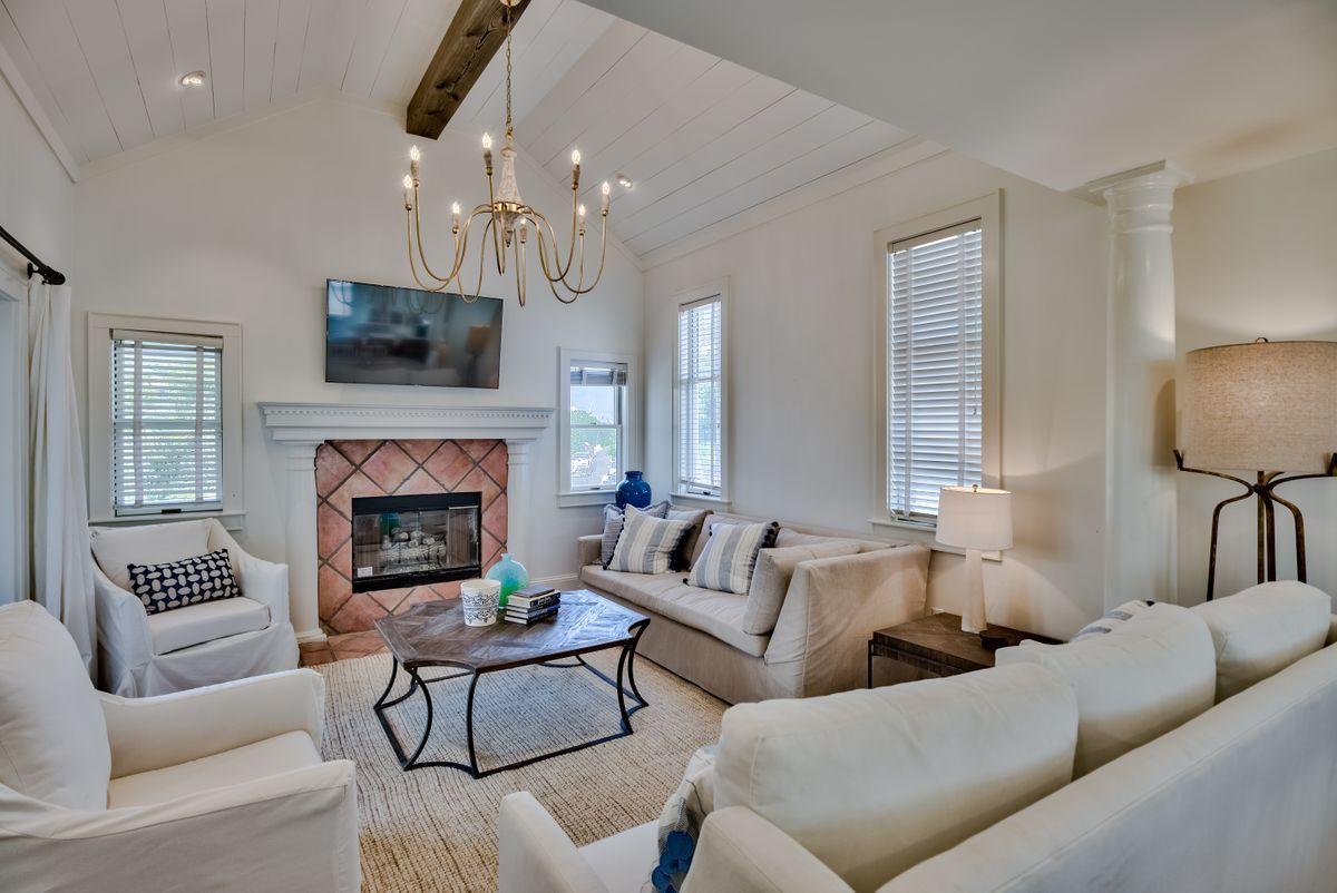 South of 30A and newly remodeled with extraordinary custom finishes curated by Old Seagrove Homes characterizes this beachside retreat with direct access to the adjacent beach board walk-over and private pool area. This exceptional reatreat is newly remodeled and finely appointed located south of 30A featuring a private pool and artfully curated by Alex Rice and Cynthia Rice of Old Seagrove homes including a stunning brand new kitchen with their signature pecky cypress cabinetry as well as a newly painted interior & exterior elevation with professionally curated furnishings & light fixtures. This pristine coastal home offers premium gulf views and has a walkway that connects to the Montgomery Street beach walkover which is directly adjacent to the private pool area and wrap around screened porch. The floorplan offers two large bedrooms on the first floor with adjoining bathrooms and offering direct access to the outdoor shower and spacious porches. The second level is anchored by the open living room, kitchen and dining area. The kitchen is fully remodeled and nicely finished with pecky cypress cabinetry and beautiful quartz countertops offering premium appliances as well as ample storage space. The charming living room is highlighted by a gas fireplace and vaulted cypress ceilings. The third floor is anchored by the master bedroom and private viewing deck which offers southwestern vistas over the Gulf of Mexico. This property would make an ideal rental or second home, located in the heart of Seagrove Beach and offering ample parking as well as owner's storage with short proximity to all the world class shopping, dining and entertainment in Seaside and Watercolor.