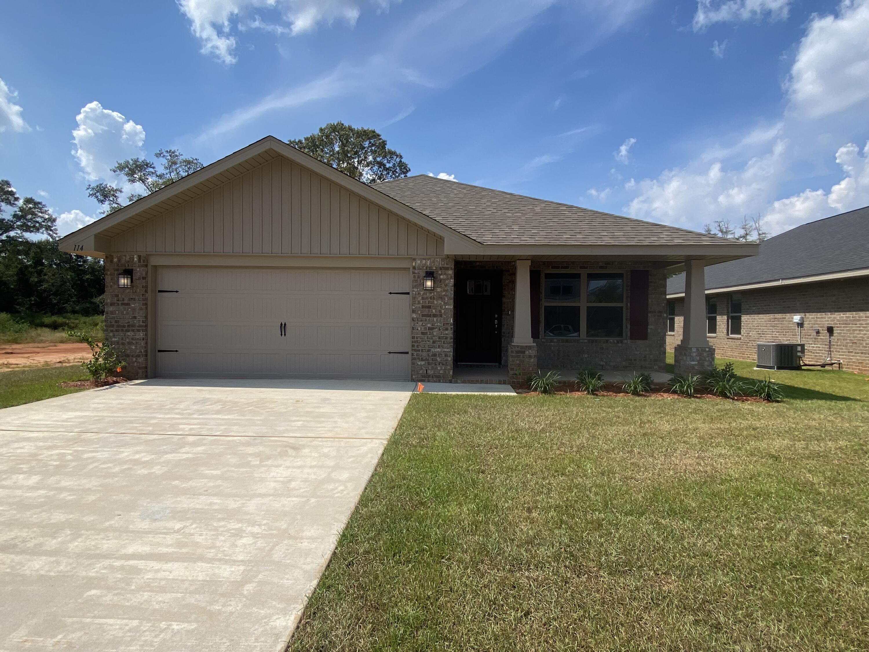 This beautiful home has 3 bedrooms and 2 full baths in 1727 sq ft! You'll have covered porches both front and back with 4 sided brick. The yard is fully sodded with professional landscaping and sprinklers !The kitchen has a nice breakfast bar and large pantry. Appliances are stainless steel, all electric. Upgrades include granite countertops in the kitchen, core tec flooring throughout with carpet only in bedrooms, and the master bath has a separate shower with garden tub. This home comes with 5 1/4 inch baseboards and a brushed satin  nickel light package. Youll have 36' high vanities in all bathrooms with moen faucets. The subdivision has a community pool and bath house. There is ample shopping and dining with a rated schools. This home comes with a 10 yr Bonded Builders Warranty.