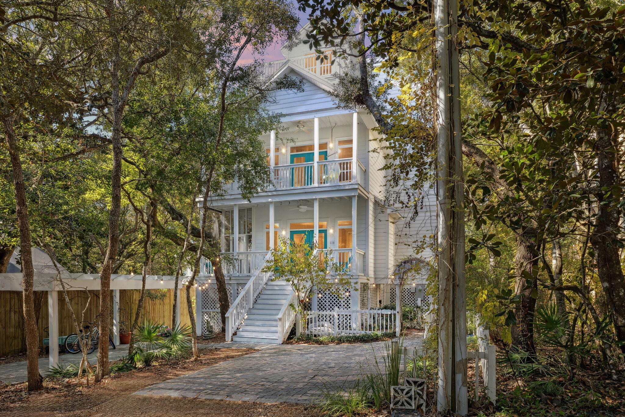 Welcome to a truly special Old Seagrove retreat where charm, privacy, and modern comfort come together in a way that rarely becomes available. 

Just one and a half blocks to the sugar-white sand and a short stroll to Seaside, this coastal haven sits quietly among mature live oaks that wrap the home in a peaceful treehouse-style setting. Large windows allow natural light to pour through every space while maintaining a quiet sense of privacy, making the home feel both bright and tucked away. Step inside and experience an inviting open layout where 12-foot ceilings, 7-foot windows, and warm all-pine floors set a relaxed coastal tone. The living, dining, and kitchen areas flow effortlessly for gathering and everyday comfort, and the kitchen now includes a double oven that enhances both hosting and day-to-day convenience. The first-floor bathroom has been newly updated, and the flexible first-floor bedroom continues to offer floor-to-ceiling bookcases and a Murphy bed, making it ideal as a guest room, office, or studio.

The second level features two spacious master suites, each with a private bath and porch access. One of the suites now includes a large owner's closet that was thoughtfully added to maximize storage and function. The third-floor tower elevates the experience even more with Gulf glimpses over the treetops and an outdoor deck recently resurfaced with durable polyconcrete, which creates a stunning space for stargazing or enjoying fireworks drifting over the water.

This home has been maintained and improved with care. Recent upgrades include two new AC systems installed in 2023, an updated electrical panel with surge protection added in 2024, and a brand-new roof completed in November 2025. With 9 feet of space under the home, there is plenty of room for bikes, paddleboards, beach gear, and storage that both full-time residents and vacationers will appreciate.

Outdoor living is one of this property's greatest gifts. With more than 1,000 square feet of porches across multiple levels, including both screened and open spaces, there is always a quiet place to enjoy coffee, unwind with a book, or take in the ocean breeze. The backyard deck invites afternoons in a hammock, casual barbecues, outdoor dining, or tending a small garden. Three-quarters fencing enhances the sense of calm and privacy.

All of this sits on a coveted 50x100 lot in Old Seagrove where you can walk or bike to beach access, Seaside, WaterColor, Publix, banks, local restaurants, and the trails that wind along 30A. It is a rare blend of convenience, character, and coastal lifestyle in one of the most beloved neighborhoods on the Gulf.

Homes with this charm, this privacy, and this level of thoughtful updating are rarely offered. This is the Old Seagrove experience so many dream of but so few ever find.

Buyer to verify all information.