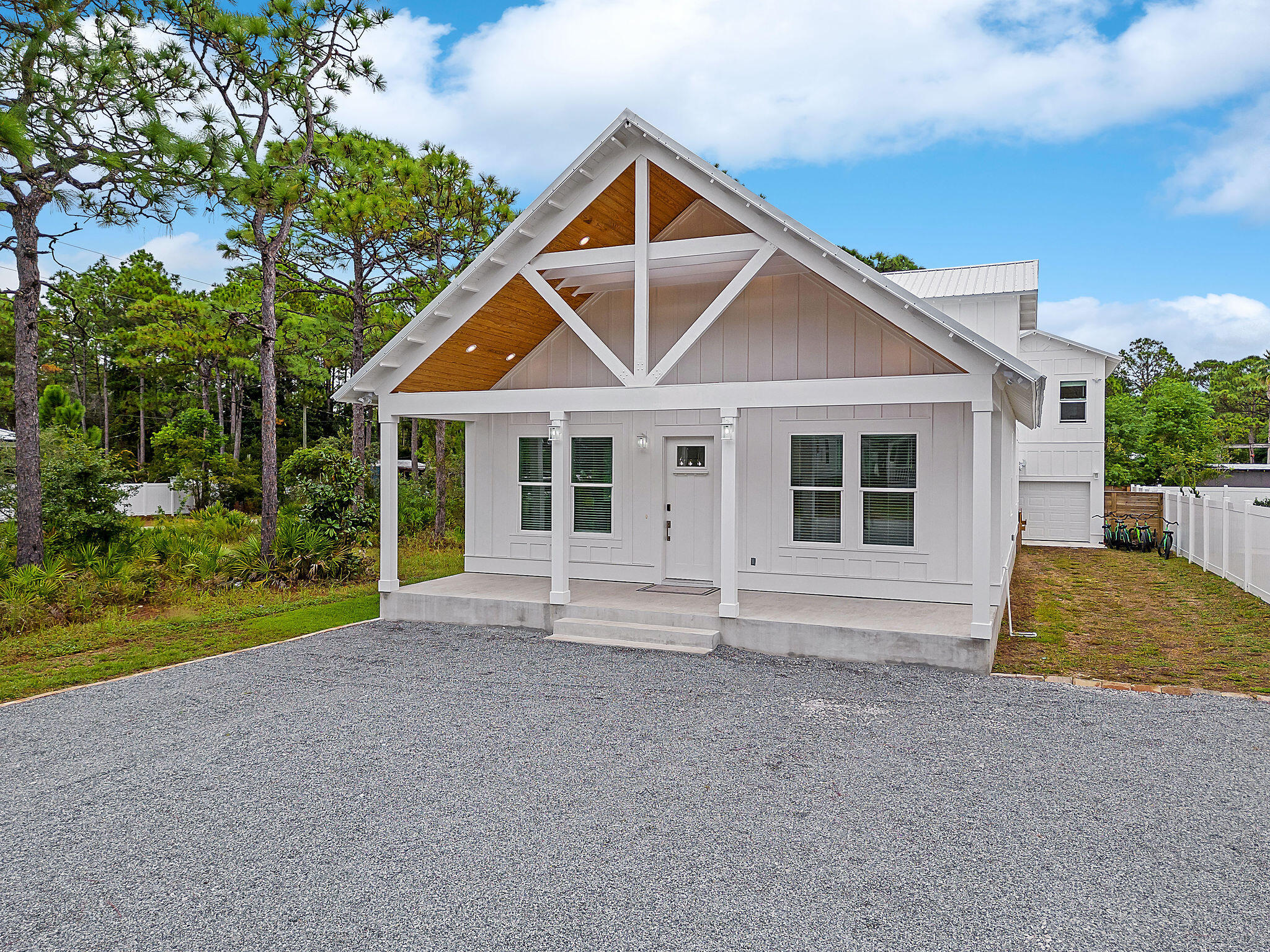 Built in 2022, this modern Gulf Shore Manor home is a beacon of contemporary luxury. With modern décor and furnishings, it offers a fresh take on coastal living. Nestled in a non-HOA community, this property presents a golden investment opportunity. Situated just half a mile from the Gulf and the San Juan Beach access, it is a prime spot for short-term rentals. Enjoy the ultimate relaxation with your own private pool and hot tub, complemented by outdoor entertaining space. Natural light floods every room, creating an inviting ambiance. The home has 5 bedrooms and 4.5 bathrooms catering to both accessibility and comfort. There is an additional bonus room upstairs with flexible space for a game room, media room or additional bedroom conversion. A carriage house with a kitchenette adds a layer of versatility, perfect for guests or additional income. A conditioned single car garage with an ice maker makes it easy to fill your cooler for the beach. Oversized parking completes the picture of convenience. Located near Seaside's shopping and dining, this residence stands as a gateway to the vibrant coastal lifestyle.