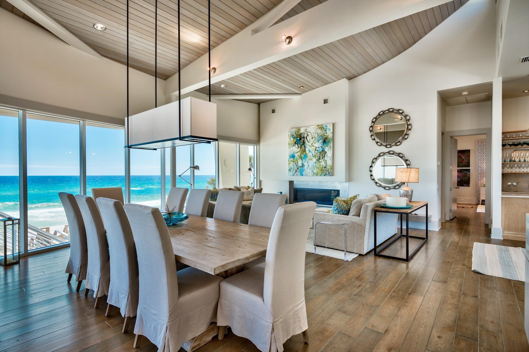 One of the most impressive Gulf front homes along Scenic Highway 30A, this masterfully designed 5 bedroom, 6 -1/2 bath property displays remarkable contemporary architecture. Featured in Coastal Living Magazine, this rare and sophisticated property boasts the finest attributes of waterfront living. Designed by architect Scott Ballard from Houston, Texas, and located in the exclusive gated community of Gulf Dunes in Santa Rosa Beach, almost every room enjoys views of the Gulf of Mexico. Step inside and discover three floors of quality craftsmanship, including the top floor open living space, complete with dramatic ceiling lines and an impressive wall of windows capturing the breath taking views. The third floor living area is complemented by a gas fireplace, wet bar, a state of the art chef's kitchen with professional appliances, as well as access to one of the numerous and expansive patios that take relaxing and entertaining to the next level. Guests and family will love the poolside game room with additional wet bar and full bathroom, that opens to the stunning pool deck complete with summer kitchen. Just steps away from one of the most sought after beaches in all of Florida, this one of a kind custom residence offers the highest quality of construction and design details.