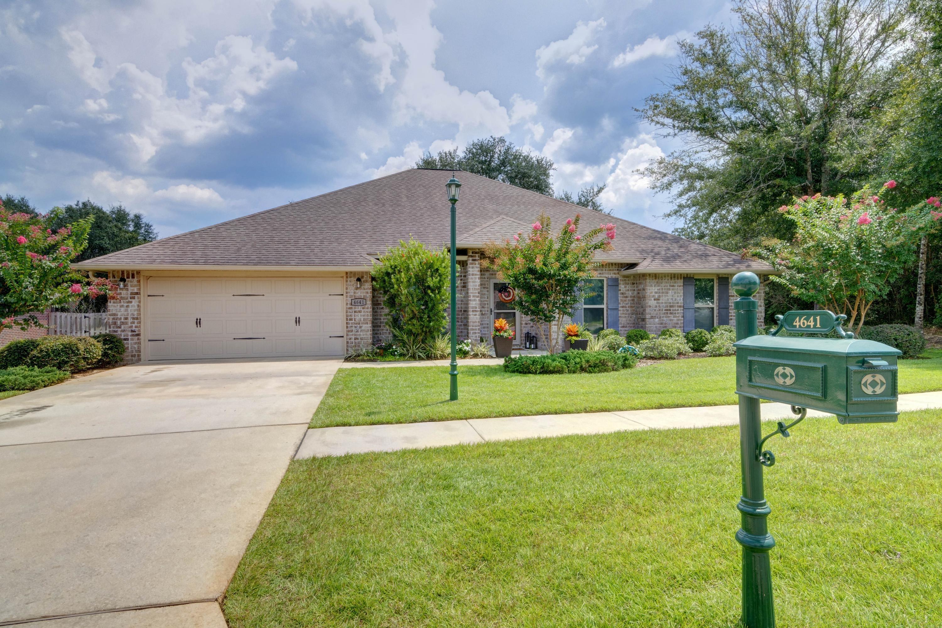 Located in the popular gated community of Chanan Estates, this south Crestview all brick stunner is the perfect home you've been searching for! Featuring 5 spacious bedrooms, 3 bathrooms, PLUS a huge upstairs bonus room (currently a man cave) AND a formal dining room this fully upgraded home is move in ready and the fully fenced in backyard has plenty of room for a pool! Pull in the driveway and appreciate the beautiful landscaping, sidewalks, and streetlights. Walk through the door and your jaw will drop as you take in the open floor plan and the massive living room to enjoy! The front right bedroom which has two closets can also be used as an office as it has two different entry doors. The dining room has plenty of room for a large farmhouse style table, and enter into the delight of a kitchen featuring custom cabinetry, granite counters, stainless appliances an adorable kitchen island, and a great sized walk in pantry and an eat in kitchen. The split floor plan showcases the fantastic owner's suite on one site of the house complete with trey ceilings in the bedroom along with sliding doors to the covered patio, and a bathroom sure to impress with a custom vanity, granite counters, and a walk in tiled shower with separate bathtub. The other three nice sized bedrooms are located on the other side of the house with three sharing a bathroom and the laundry room between them, and the other bedroom with it's own third bathroom. Upstairs is the massive bonus room where the possibilities are endless to enjoy! This home is complete with a two car garage and a massive backyard on an almost .30 acre lot. Don't delay in calling this beautiful home your own!