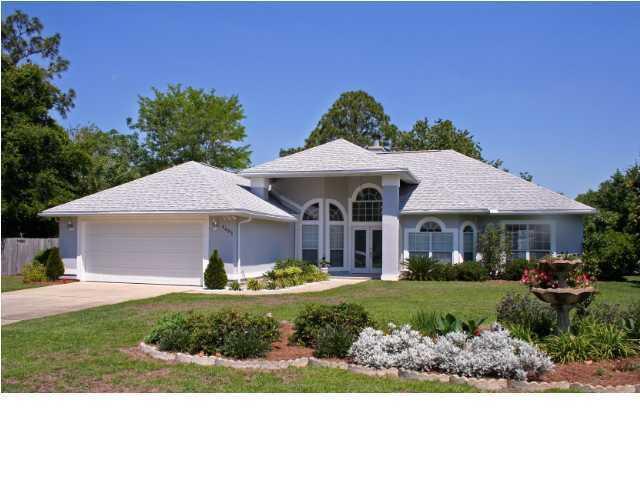 This beautiful home with traditional touches and a contemporary style is located in the very quiet neighborhood of Raintree Estates. High ceilings and lots of windows create a very bright interior. The open floor plan and open kitchen make the house feel very spacious. The screened in patio in the back of the house gives access to a huge fenced in lush backyard with lemon and mandarin trees.