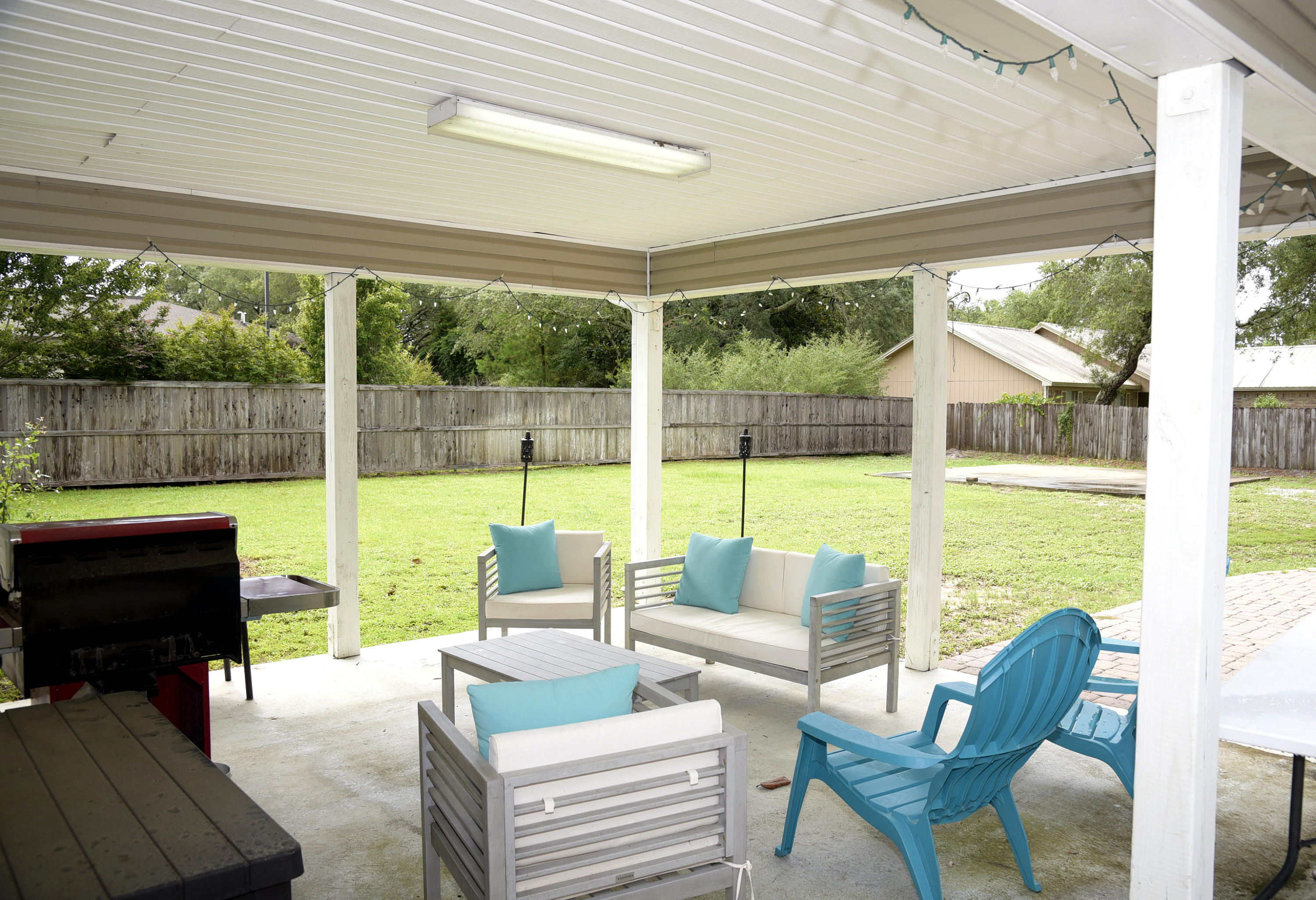 This lovely 2000 sq. ft. 4 bedroom 2 full bath home home has had a number of upgrades and is ready for you to settle in and enjoy life on the Emerald Coast. The kitchen features granite countertops, breakfast bar, stainless steel appliances and a farmhouse sink! There are beautiful hardwood floors in many rooms as well as updated lighting, ceiling fans and mirrors. The vaulted ceiling in the living area gives a spacious feel and the many windows make it bright and cheery. On .36 of an acre, the lot is large and able to accomodate anything you might think of! A second garage or workshop? There is already a large cement pad poured just for that reason and there is still room for a pool! Park your boat or RV there and enjoy the high privacy fence that makes you feel like you are in the country while being in the city! An open paver patio and covered back patio make it easy to enjoy the backyard. New roof in 2017 and HVAC in 2020-what more could you want? This is a rare find for Niceville.
