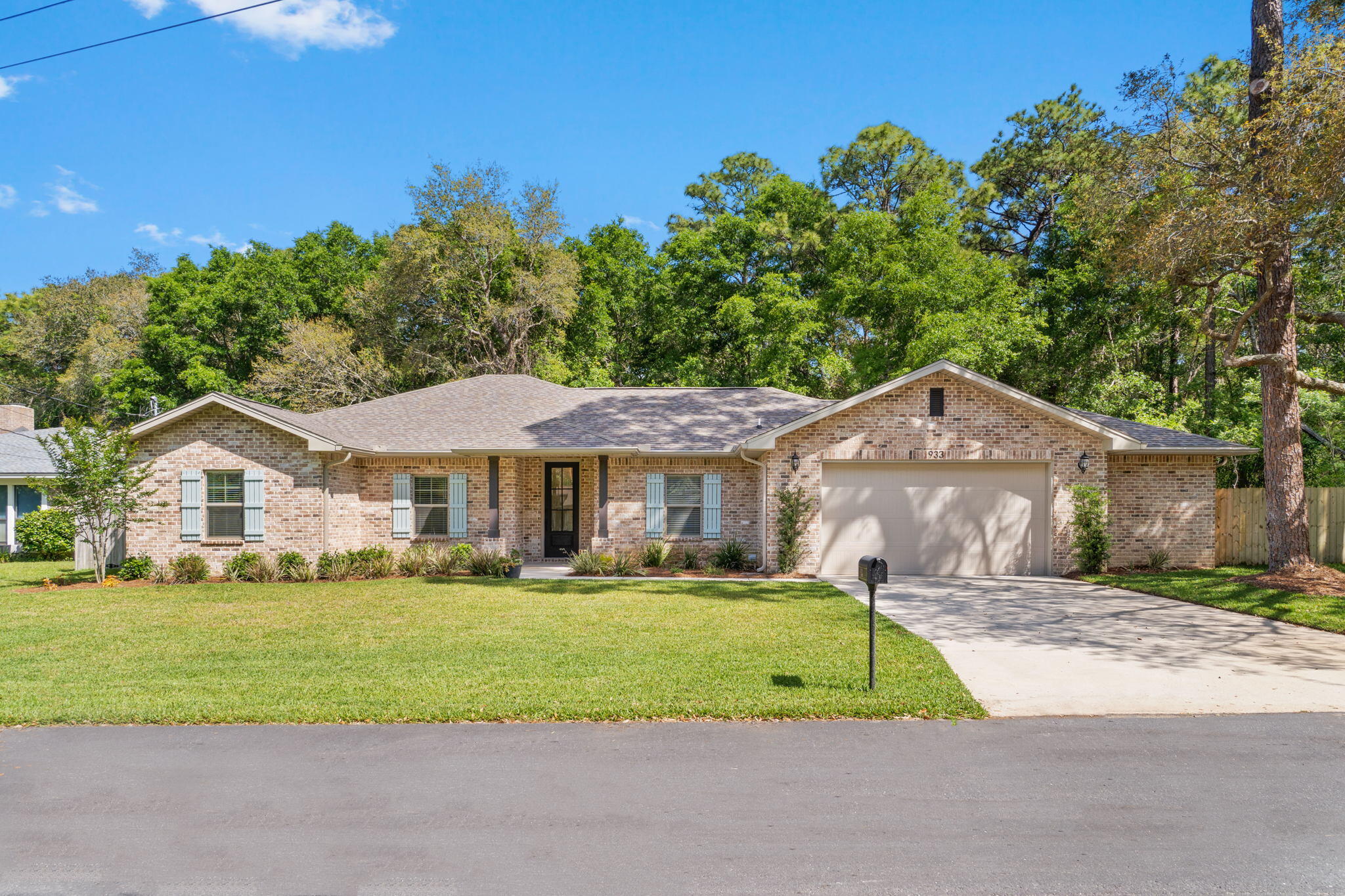 Welcome to this stunning 4 bedroom/3 bath custom all brick home with a fantastic floor plan located just 8 minutes from Hurlburt Field and 10 minutes from Eglin AFB on a private lot which will never have the land behind it developed. Pull up into the driveway and appreciate the superb curb appeal and mature trees. Inside you'll find 10ft ceilings, crown molding, and luxury vinyl plank flooring throughout the main living areas and all four bedrooms. Open to the spacious living room is the gourmet kitchen which boasts shaker style white cabinetry, Quartz countertops, a counter level breakfast bar and stainless appliances including an oversized commercial grade fridge/freezer. All cabinetry features soft close glides and hinges and the island is completely functional with storage on the back side. A walk-in pantry is located at the right rear of the kitchen which is across from the interior "drop zone/mud room" and leads to the interior laundry room that conveniently has a cabinetry, Quartz counters for a folding area, and a sink. The split floorplan features the owner's suite which is a fantastic oasis complete with an oversized room with recessed lighting, and the en suite bathroom that's complete with double vanities with quartz counters, two separate linen closets, private water closet, a custom walk-in shower with glass enclosure, a garden tub, and a large walk-in closet. This unique and functional floor plan features another bedroom on the other side of the house with its own private bathroom and walk in closet that would serve wonderfully for someone wanting a little more privacy. The other bedrooms are great sized (currently set up as an office and the other as a home gym) and share a great sized third bathroom with all the same high end features and finishes. A covered porch is located at the rear of the home, perfect for entertaining or enjoying the peaceful setting. The yard is beautifully landscaped, has a privacy fence, and comes complete with a sprinkler system, well, pump and timer. Fabric Shield window coverings are provided for storm protection and a current survey is available. Welcome home!