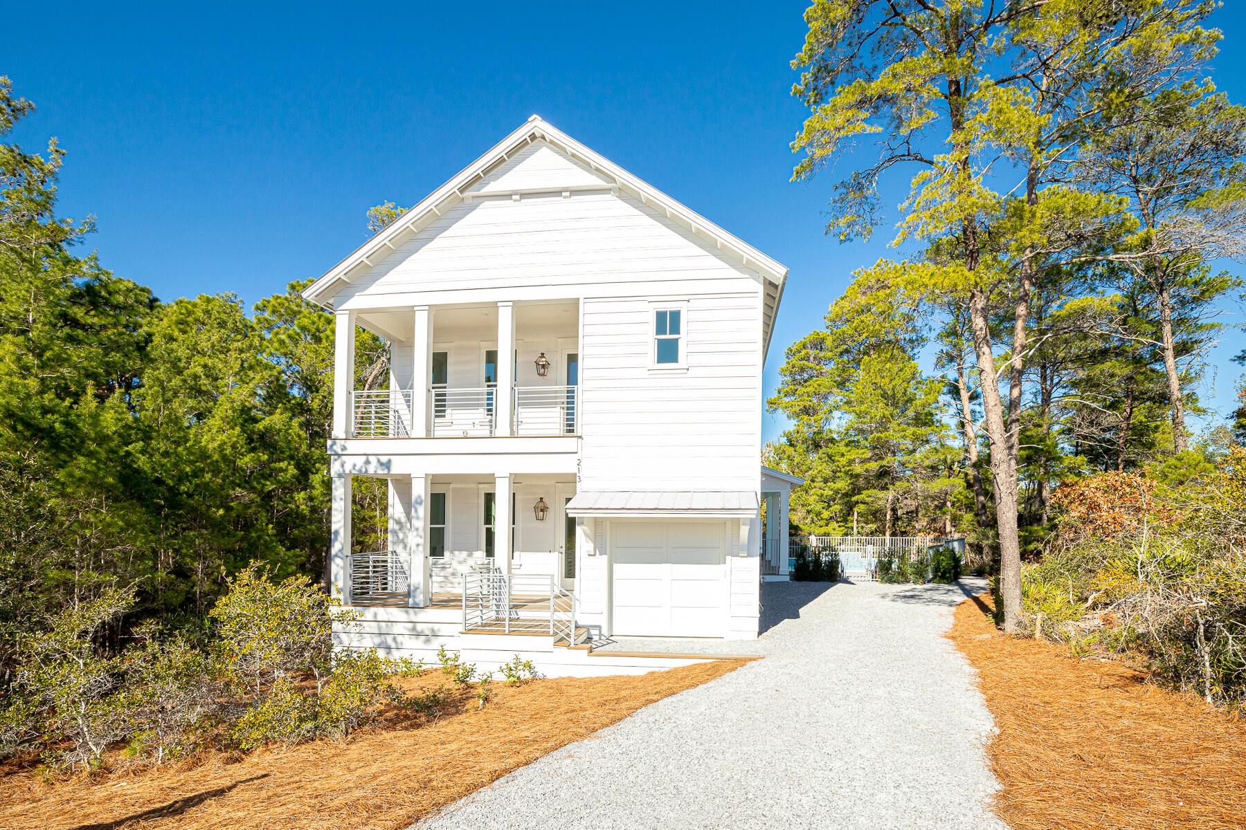 Seller is offering a $10,000 credit toward Buyer closing costs. Welcome to the tranquil setting of this newly completed 4 bedroom home, a hidden gem along the west end of 30A. Whatever your dream checklist, 213 Spotted Dolphin has it all. Want to live at the beach with a private pool? Or would you like to maximize your investment with the projected rental income of $130-160k. This tucked away, cul-de-sac location has no association fees and 3 public beach accesses within a mile range. Upon entering the home, you will immediately sense the quality construction with curated lighting package, shiplap walls, 10-foot ceilings throughout, and generous storage areas. The ground level offers a junior master suite, an open concept great room, with spacious kitchen featuring quartz countertops and gas range. The second floor offers Step outside for a dip in your private pool adjacent to preserved green space. You will enjoy catching the sound of the waves of the Gulf of Mexico on those southern winds. 

The second floor showcases your primary master quarters complete with a large bathroom and walk-in closet. Additionally you will find two Guest suites, a secondary living area, and Bonus room perfect for an office, storage or bunks. With generous closets and storage, as well as a golf cart sized garage, this home presents as an excellent option for a full time, second home or short-term rental property. Enjoy world class dining and boutique shopping as well as the conveniences of nearby schools, hospitals and grocery stores. Join others who own and love the beauty of life on Spotted Dolphin!