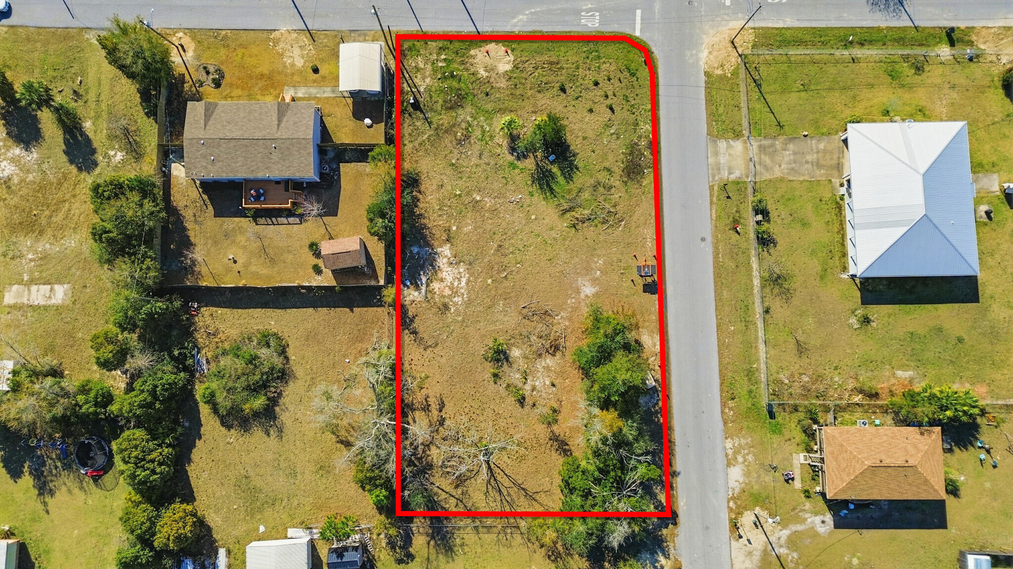 An excellent opportunity to build on this cleared, nearly half-acre corner lot in an established Panama City neighborhood. The approximately 100 × 200 ft parcel is level and ready for a custom home. Public water, sewer, electric, and natural gas are available, and a private well is already in place. Located in the Springfield area, the property offers city convenience with flexibility to design a home that fits your vision. Enjoy quick access to shopping, dining, schools, major roadways, and a short drive to Tyndall Air Force Base. A rare cleared homesite with utilities available and room to create something truly your own.