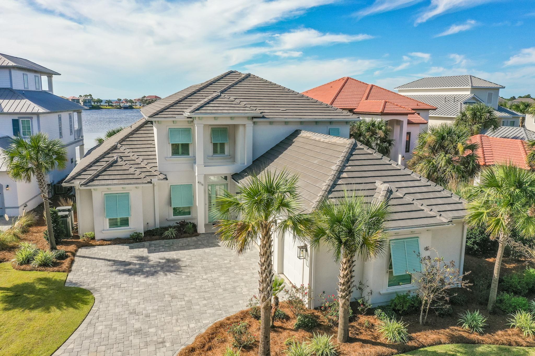 Custom Built two year old 6br house on the lake in Destiny East with Gulf views.  No details were spared when this house was built and has all of the current  finishing touches and accessories that one expects for a home of this stature. This home boasts a wide open floor plan with views from every room, state of the art kitchen, high ceilings, custom cabinets, ample outdoor space, a three car garage and so much more. The outdoor living space includes a summer kitchen and infinity edge pool overlooking the lake to enjoy fantastic sunsets.  This home truly needs to be seen in person to appreciate all the details and will make a perfect  primary residence or investment property for its next owner. Rental projections are 116k for a 5br and 125k for a 6br as owners use one bedroom as an office