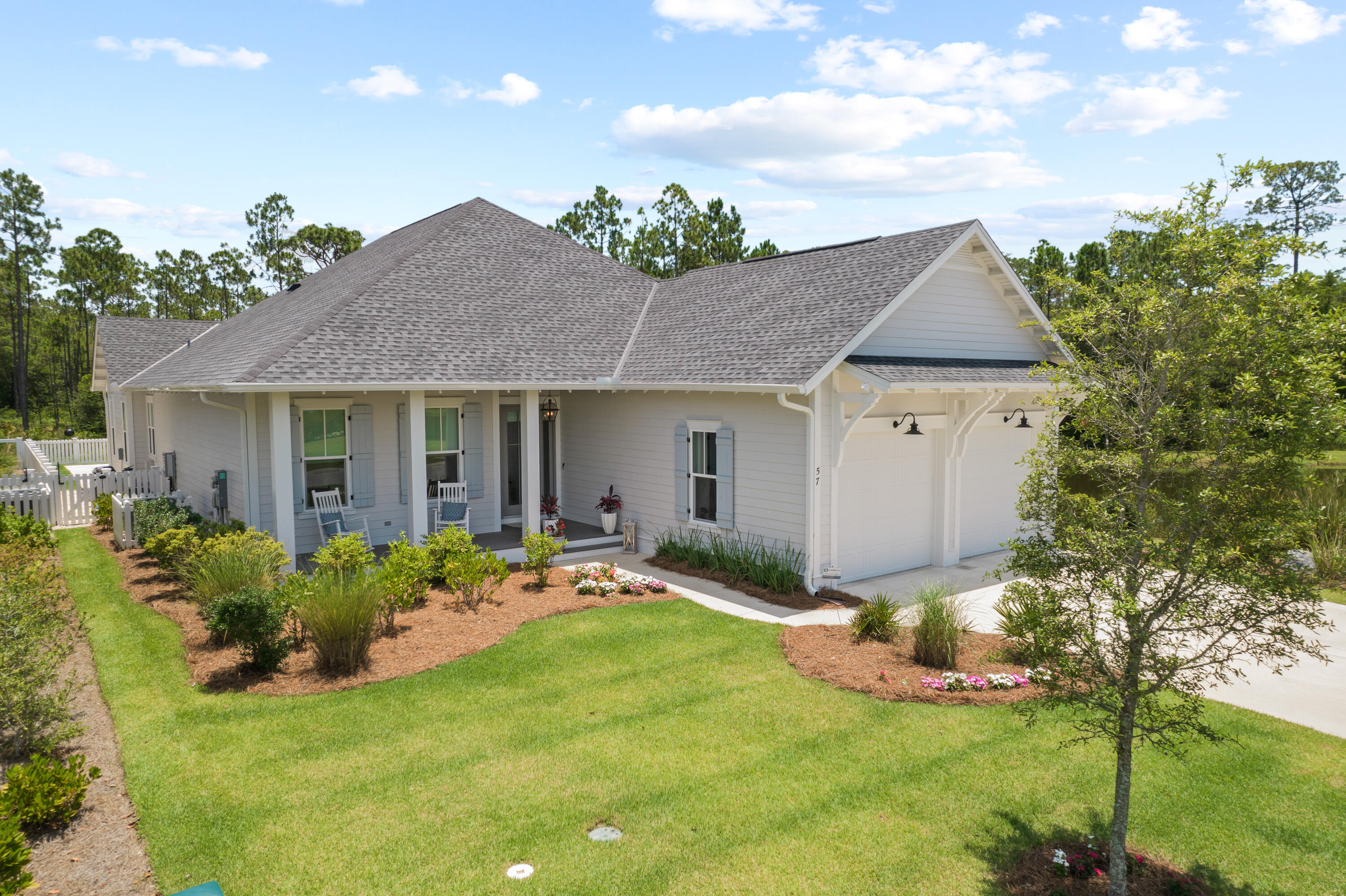 Highly sought after quiet corner lot location in Watersound Origins. This Huff Home (Ficus model) features all of the upgrades - quartz counters, hardwood floors, lap and gap wall features throughout, large walk-in showers in all 3 en-suite baths with separate tub in master bath, 10' ceilings, dual fuel 6-burner Wolf stove/oven, and custom paneled Subzero fridge, 24'' microwave drawer, and walk-in pantry with quartz counter.  Extra finishes include custom blinds, linen wallpaper and crown molding throughout. The 4th bedroom as shown on the Ficus model plan is currently being used as an office/den.
 
Outside, enjoy a beautiful screened in porch that overlooks your private pool/spa surrounded with travertine and custom umbrellas. This quiet corner lot is tucked away giving a very private feel.  There are nature views all around - a pond to the side and a wooded area behind.