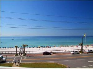 This spacious up front 2br/2ba Destin Surfside Condo unit offers floor to ceiling windows in L.R., D.R. & kitchen to allow incredible views of the Gulf of Mexico! The front row corner units also offer large balconies for your enjoyment of the sights & sounds of the gulf.
Resort amenities include a full service front desk located in a beautiful lobby open daily to assist owners and their guests, on-site maintenance and management offices, resort security, heated and cooled interior corridors, 2 covered parking garages for guests and owners, an onsite restaurant, tiki hut serving sandwiches and drinks (operated seasonally), elevated pedestrian bridge over Scenic Gulf Dr., expansive pool deck overlooking the gulf with a large heated pool, hot tubs, bath house with showers and sauna; sports deck with tennis court, basketball, handball, shuffleboard; fitness center, massage and hair salon and unlimited wireless internet service.