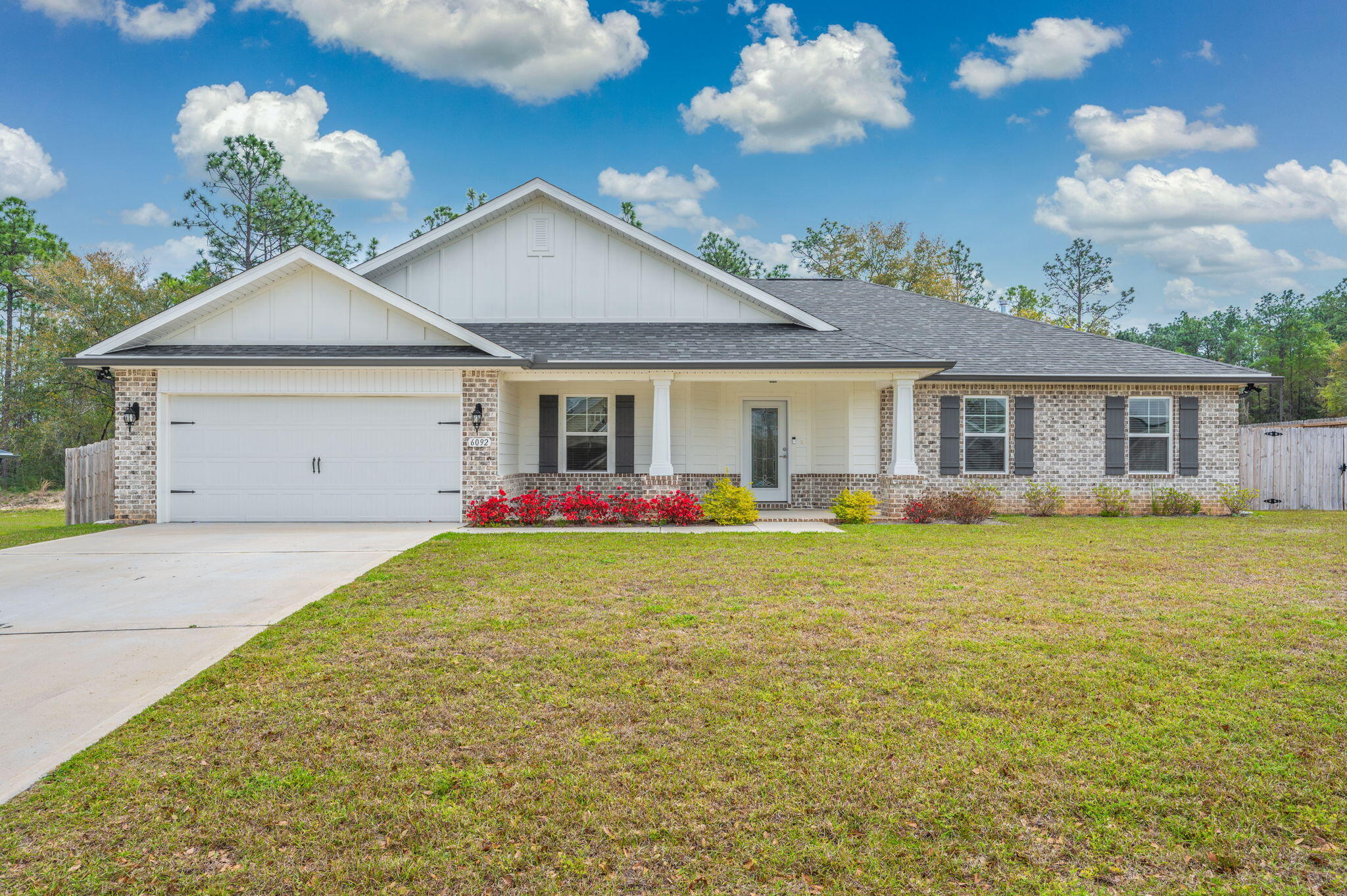Located on a Prime Corner Lot in Nature Lake!  Built with durable 2x6 exterior wall construction, this thoughtfully designed split-bedroom floor plan offers 3 bedrooms, 2 baths, and a 2-car garage. Inside, you'll find a spacious family room, dining area, and a versatile bonus room--perfect for a home office or flex space. Enjoy laminate wood plank flooring throughout, with tile in all bathrooms. The kitchen is beautifully appointed with granite countertops, a center island, and stainless steel appliances. The primary suite is a true retreat, featuring a signature zero-entry, all-tile walk-in shower with dual shower heads, a separate soaking tub, granite double vanities, tile flooring, and a large walk-in closet. Additional features include ceiling fans, a covered rear lanai, Sprinkler Sys. Additional features include ceiling fans in the main living area and all bedrooms,or outdoor living, and a full irrigation system.