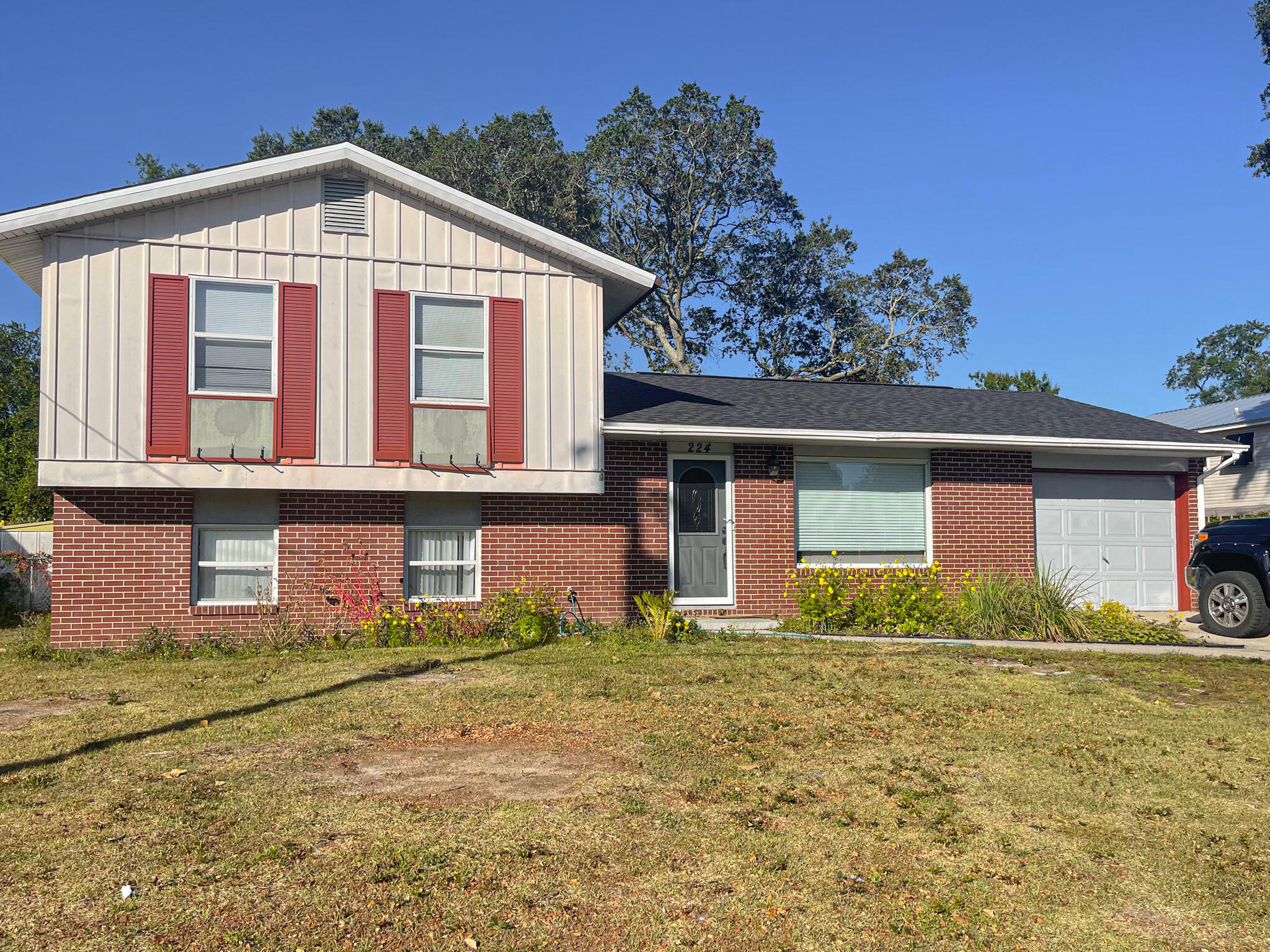 This spacious split-level home is located in the desirable neighborhood of Bayou Woods. NEW ROOF installed in 2021. Kitchen has beautiful granite tile counter tops, designer lighting, upgraded stainless/black appliances, nice tile backsplash, wainscoting accent wall and a large window over the sink overlooking the backyard.