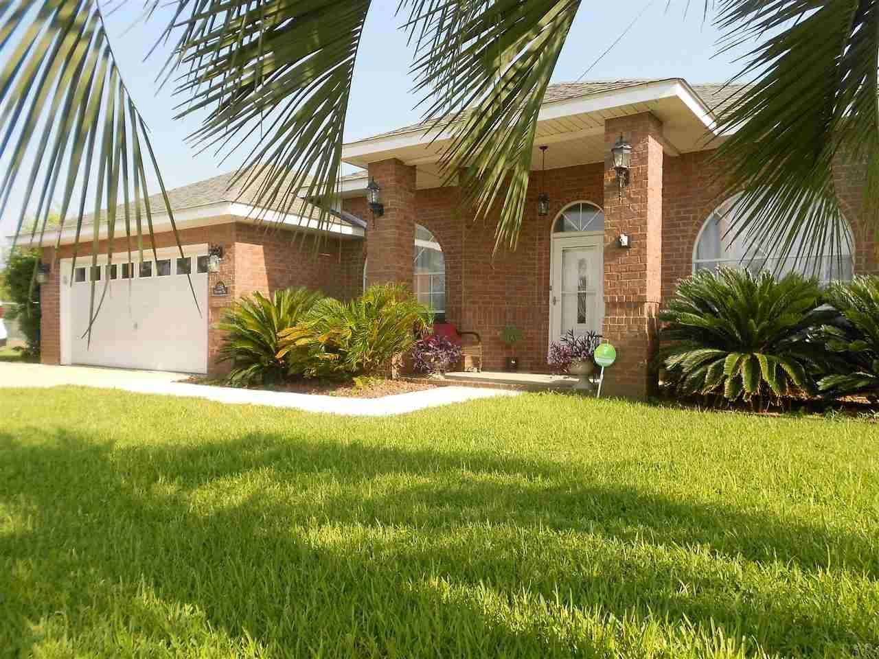 Experience home life in a modern sanctuary of privacy and comfort! This home says, Polished & Refined with the many upgrades over the last 5-years. Enjoy a refreshing swim in the 16' x 30' heated saltwater pool; entertain under the covered and screened pool patio with two paddle fans. Bring an extra family-member to live in the attached in-law suite; in-law suite is complete with a separate entrance, kitchen, bath and laundry. The extra living area could also be converted to a separate rental space, offering the new owners a residual monthly income. Easy parking with the 2-car garage and expanded 3-car driveway. Stay Green and be energy efficient with the GE Hybrid hot water heater installed in 2014. Schedule a time to show this home today!