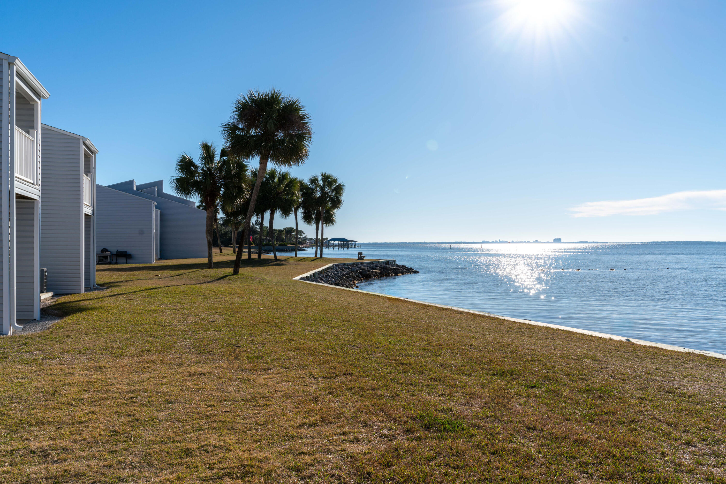 Welcome to your dream home! This exquisite 2 bed, 2 bath condo in the prestigious Finisterra Community offers unparalleled views of Choctawhatchee Bay and Lake Clyde. Step inside and be amazed by the recent upgrades and renovations that have transformed this condo into a modern masterpiece. From the new floors, water heater, and HVAC system, to the stylish bathroom vanities, showers, and plumbing, every detail has been carefully considered. The kitchen is a chef's delight with its new matching appliances, cabinets, granite countertops, sink, and faucet. Plus, it has been extended beyond the standard 2/2 layout, providing extra space for a second pantry and a convenient breakfast bar.

Not only does this condo boast an impressive interior, but it also offers a wealth of amenities within the community. Imagine starting your day with a refreshing swim in the pool, playing a match on the tennis courts, or launching your kayak from the beach access area. And with a laundry mat on-site, you'll have all the conveniences right at your fingertips.

Rest easy knowing that this condo has been meticulously maintained, with new dimmable LED lighting fixtures, fresh paint, and even new dining room window glass. The ceiling fans in the bedrooms and the windows throughout are in great condition, so no need for renovations there.

Located in the desirable Finisterra Community, you'll have access to two marinas just steps away, perfect for boating enthusiasts. And with the newly added vinyl siding and roof, you can enjoy peace of mind knowing that this condo is not only beautiful but also well-protected.

Don't miss your chance to own this exceptional property. Schedule a showing today and experience the epitome of luxury living. The answer is 42.