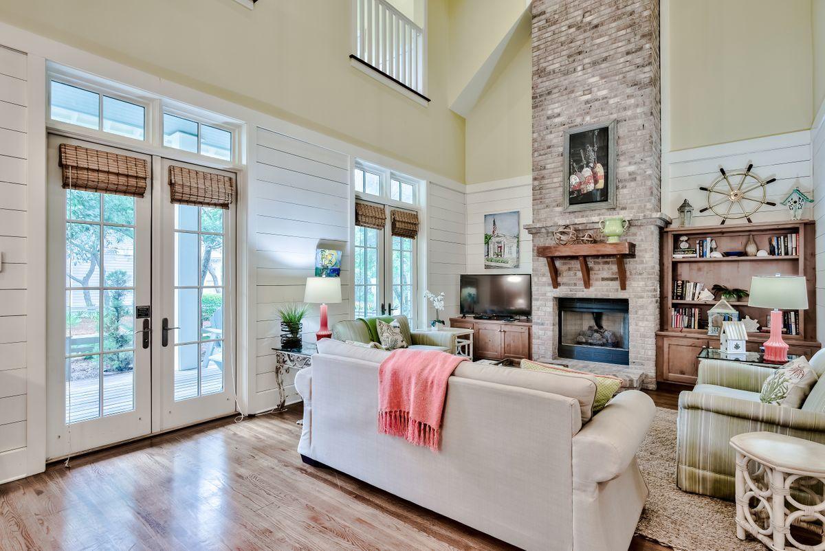 Location and lifestyle come together at this well-appointed home in WaterColor. Set on a large lot, there's ample space to add a carriage house and/or pool. The shady full-width porch is perfect for quiet relaxing and alfresco dining. Double doors lead inside. The open-plan living room is designed to make you pause and take in the tasteful
surroundings and new living room furniture included in the sale. A two-story brick fireplace and feature chimney draw the eye upwards to admire the exposed beams and
lofty vaulted ceiling high above. Reaching the kitchen, there's a center island and a marble-topped half wall connecting with the spacious dining area. It's a well-designed entertaining space for serving drinks, hors d'oevres, buffets and more formal meals. Gleaming hardwood floors flow seamlessly through each carefully curated space,
including the first floor master suite. Climb the stairs to find two guest bedrooms with private bathrooms and a second sitting area. Close to Frog Pool in WaterColor Phase III, this home is a "hop" from the first-class amenities including the private Beach Club, Camp Watercolor, shopping and dining. Relax at the Costa Chica sunset bar and make new friends while enjoying scenic views of the Gulf of Mexico. This single-family home includes many recent improvements and upgrades including a new HVAC and freshly painted exterior. For those looking for a move-in ready home with
potential for future expansion, this one ticks all the boxes.