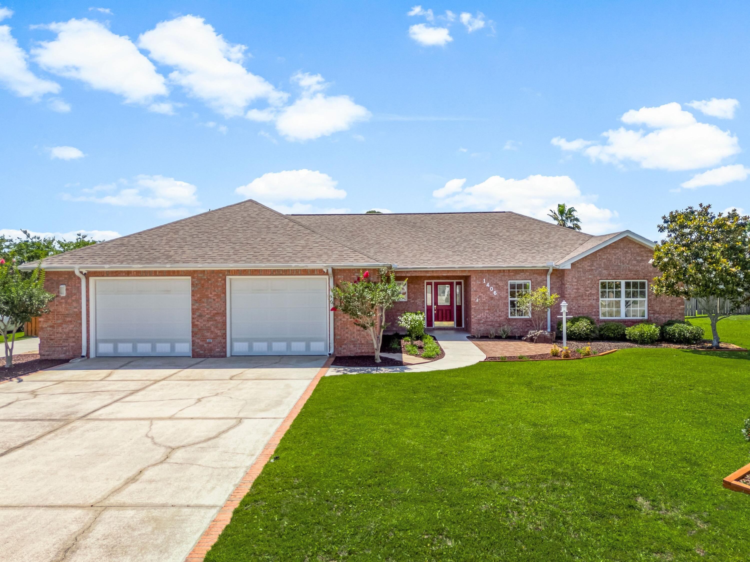 At the quiet end of a cul-de-sac in one of Lynn Haven's most established neighborhoods, this beautifully maintained four-bedroom, three-bath home offers timeless comfort and thoughtfully designed spaces for everyday living. Set on a generous 100' x 150' lot in a golf-cart-friendly area with no HOA, the property is ideal for families, retirees, or anyone seeking a relaxed lifestyle near top-rated schools and daily conveniences.

Built in 2002, the home spans 2,216 square feet and showcases a traditional brick façade, complemented by a split floor plan that includes two private en suite bedrooms. A tiled foyer with coat closet leads into a welcoming living area with 11-foot tray ceilings, crown molding, and a natural gas fireplacean ideal setting for both quiet evenings and festive gatherings. The kitchen features maple-finish cabinetry and a functional layout for cooking and conversation. It connects to a formal dining room with recessed lighting and access to the screened patioupdated in 2021 with new screens and doors. This serene space opens to a fully fenced, landscaped backyardperfect for children, pets, or unwinding with coffee in the morning light.

The spacious primary suite includes a large walk-in closet and a private bath with dual vanities, a whirlpool tub, a separate shower, and built-in storage. Secondary bedrooms are equally well-appointed, with ceiling fans and generous closets. A second ensuite offers flexible accommodations for guests or multi-generational living.

Additional highlights include a 2024 high-efficiency four-ton, 18-SEER HVAC system with new ductwork and smart thermostat, a hybrid electric water heater (2015), and a 2018 architectural shingle roof. The oversized two-car garage provides more than 780 square feet for vehicles, storage, or a workshop setup. A dedicated irrigation system, city services, and extended driveways complete the picture of ease and convenience. 1406 New Jersey Avenue is a refined retreat offering lasting quality, valuable upgrades, and a sought-after address in the heart of Lynn Haven.