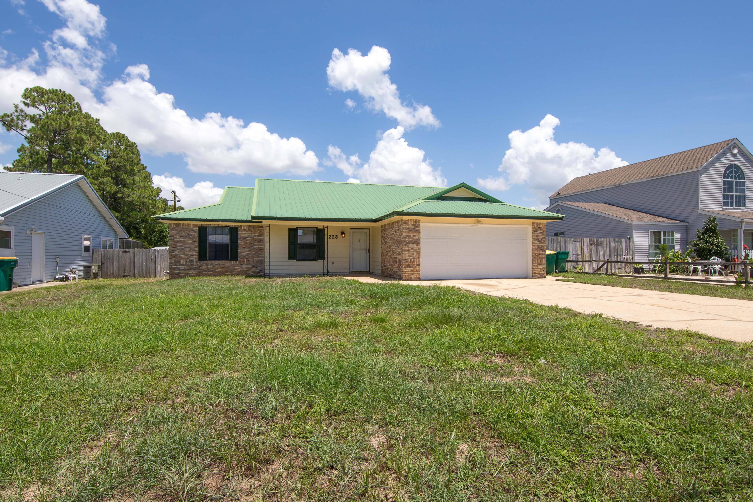 MOVE IN READY, minutes from Hurlburt Field. This 3 Bedroom 2 Full bathroom home Features and outdoor screened patio with Hot tub/ spa included. Open floor plan update kitchen and bathrooms with granite counter tops and a 2 car garage thats heated/cooled . METAL ROOF =Long life