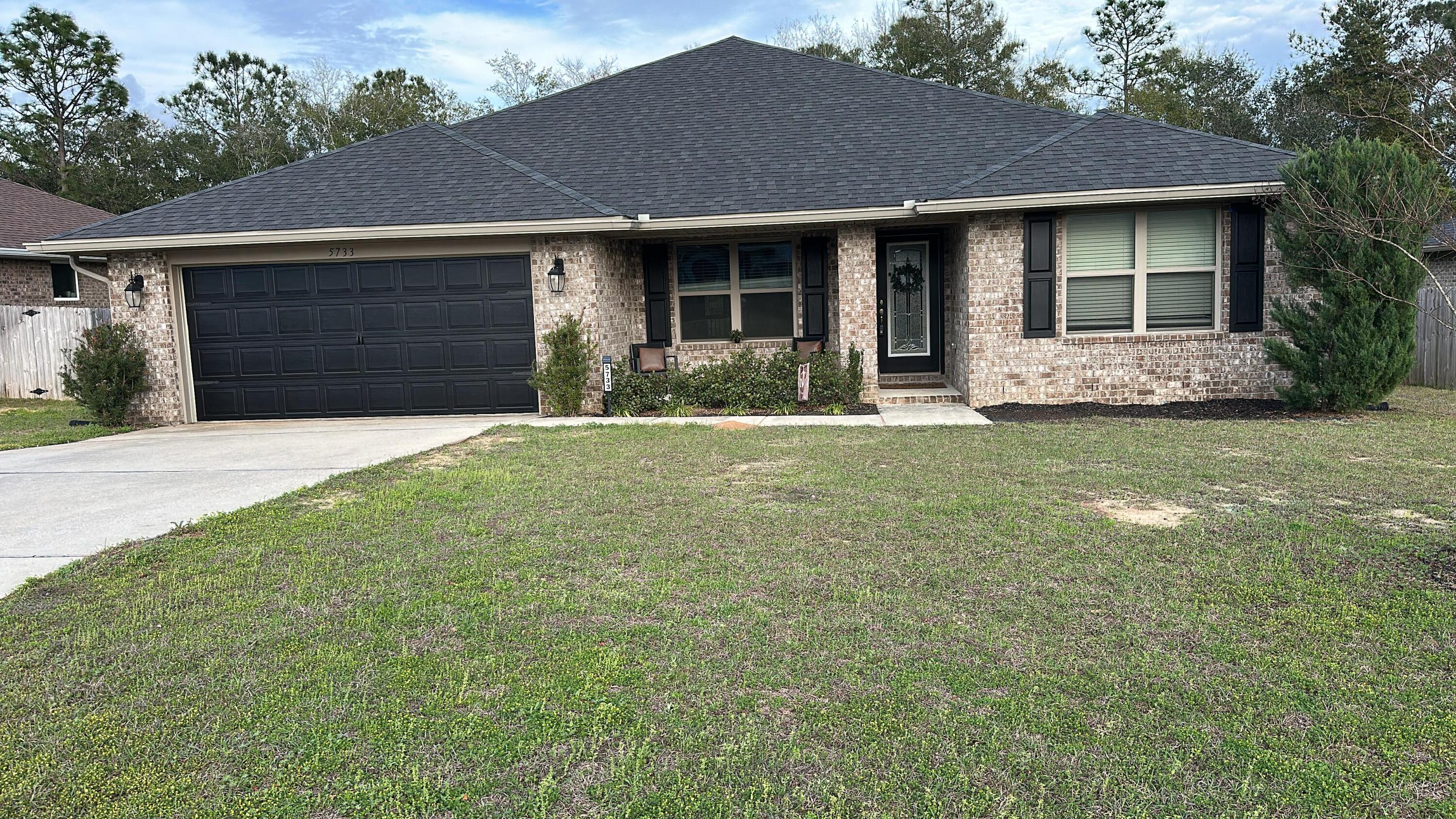 This is a stunning 5-year-old full brick home that combines modern luxury with comfort. It features 4 spacious bedrooms and a well-designed open floor plan. The interior boasts luxury vinyl flooring throughout, adding durability and style. The formal dining room is perfect for entertaining, while the open kitchen with an island and granite countertops offers a sleek, functional space for cooking and family gatherings. The primary suite includes a private bathroom with a separate tub and shower, providing a relaxing retreat. Outside, the private backyard with an open patio is ideal for outdoor activities and relaxing. The home also includes a 2-car garage and is conveniently located near the interstate and other amenities. Seller has an assumable VA 2.75 interest rate mortage.