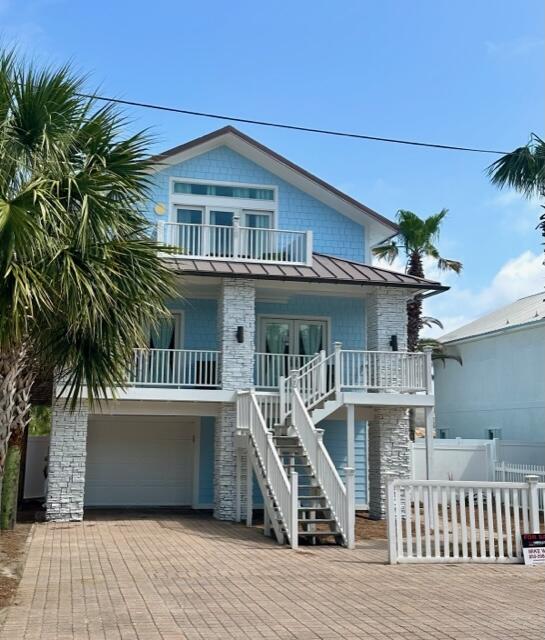 Steal this Frangista Beach house - best buy at the beach. Newly renovated money-maker located in sought after Frangista Beach. Just a 2 minute walk to the beach, this home comfortably sleeps 14-16. Rental projections show up to 160k in rental revenue. This home is a great investment home, 2nd home or primary home. Jump in to the brand new luxury pool and hot tub, and enjoy the fully renovated backyard oasis which boasts luxury granite, and an outdoor grill and eating area. The front porch is covered adding extra outdoor space. Sold fully furnished and turn key. There is a 2nd kitchen and living dining area on the first floor. This home also has an attached garage for your vehicle or golf cart. All of this is located just 2 blocks from the deeded, gated beach access. It's turnkey and ready to rent for Summer 2023. Measurements and calculations to be verified by Buyer