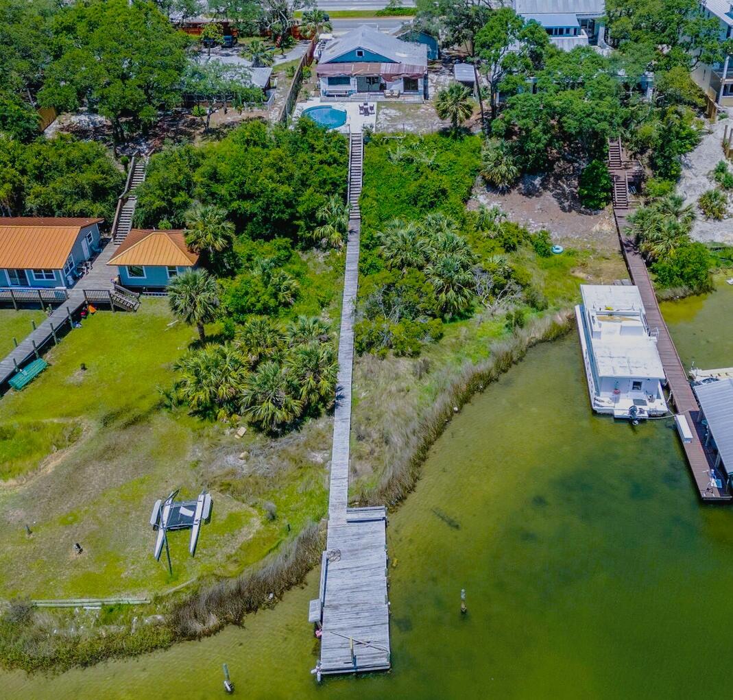 Harbor Living on this beautiful lot, this home is ready for a complete remodel for your own style.   This home has been taken down to the studs and ready for your own remodeling touches. There is a home with 1344 sq ft and a guest house with 317 sq ft.