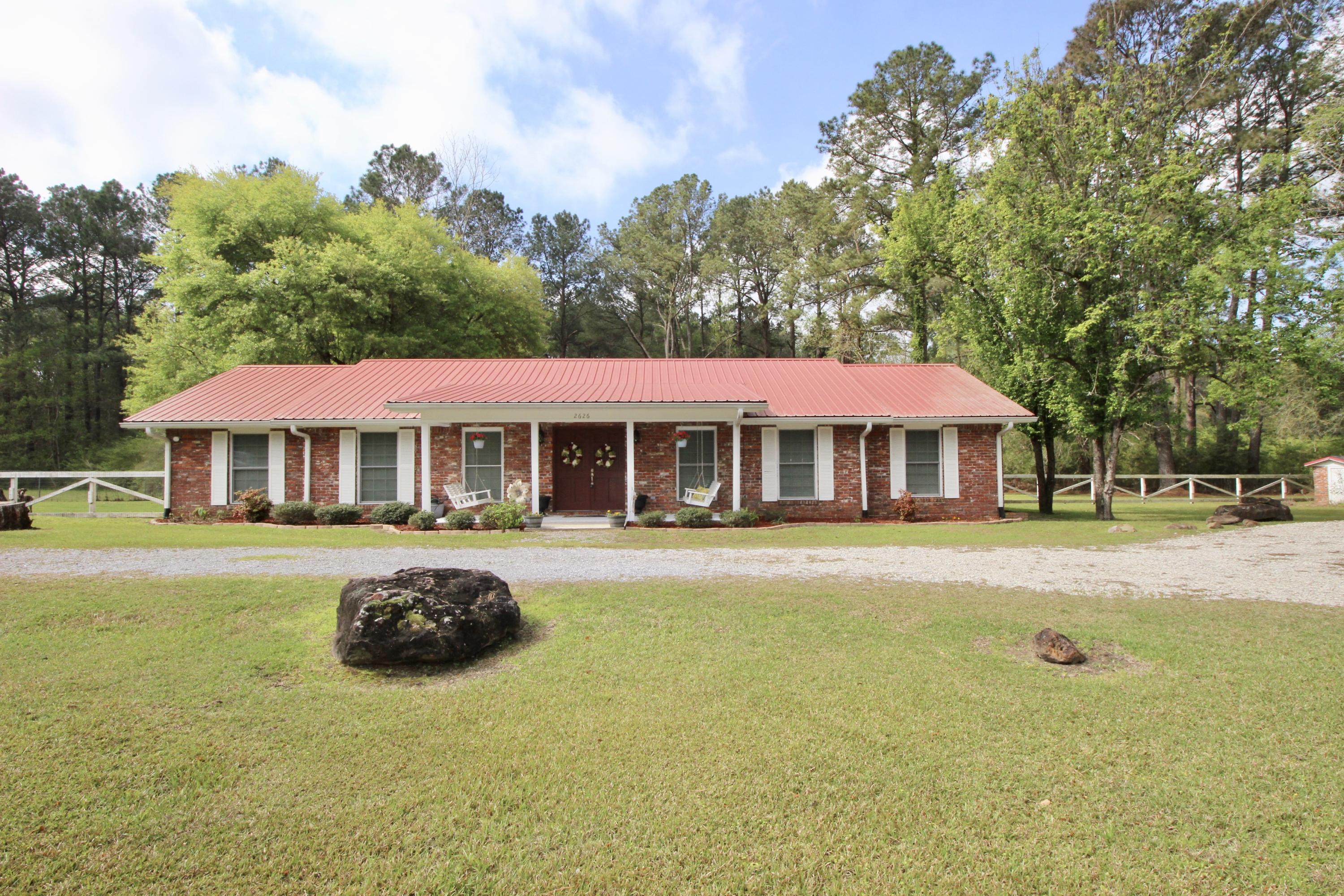 This classic, recently updated brick rancher on 1 acre is the answer to your ''farmhouse'' search! Located just outside the city, less than 5 min to downtown DeFuniak. First, you'll notice the front porch, complete with swings. Upon entering is the foyer, which leads into the large living room. There's also a multi-purpose room (currently play room) that could easily be an office. Next is the newly updated kitchen with maple cabinets, a walk-in pantry & view to the dining room, overlooking the back porch. The bedrooms are all generously sized. This home has LOADS of storage! The huge back porch is ready for grilling & family time and the fenced back yard keeps the fun going. Lastly, the 36x36 detached 2 car garage & carport finish it out. Qualifying for all types of financing, don't delay!