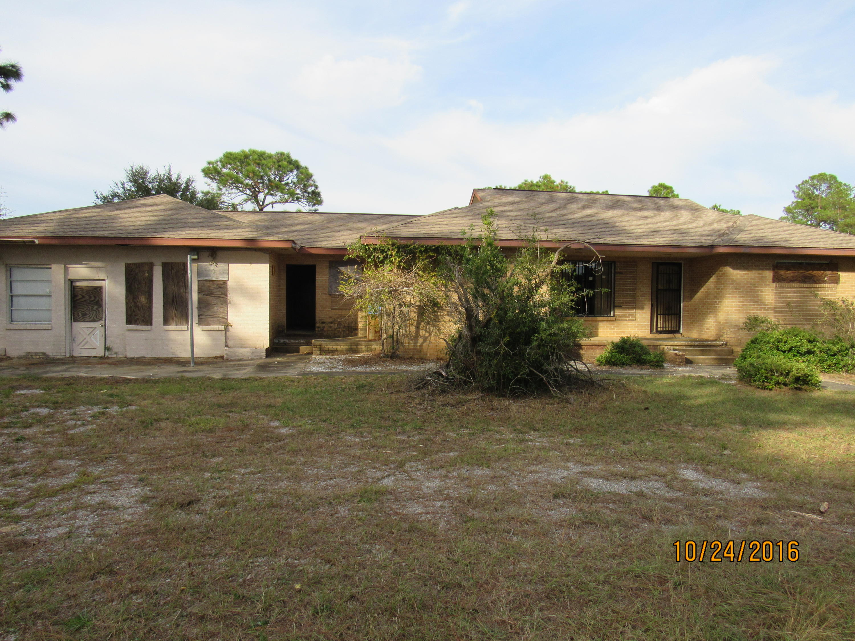 This large REO property rests very conveniently on Hwy 90 West and is mins from both Crestview, Defuniak Springs, and the Hwy 285 interchange. Built in 1951, this all brick home has 3 bedrooms and 1 bath, a large game room area and a metal roof. Home needs many repairs and will not qualify for financing. Call today with questions or to schedule your showing! Employees and family members residing with employees of JPMorgan Chase Bank, N.A, its affiliates or subsidiaries are strictly prohibited from directly or indirectly purchasing any property owned by JPMorgan Chase Bank, N.A.