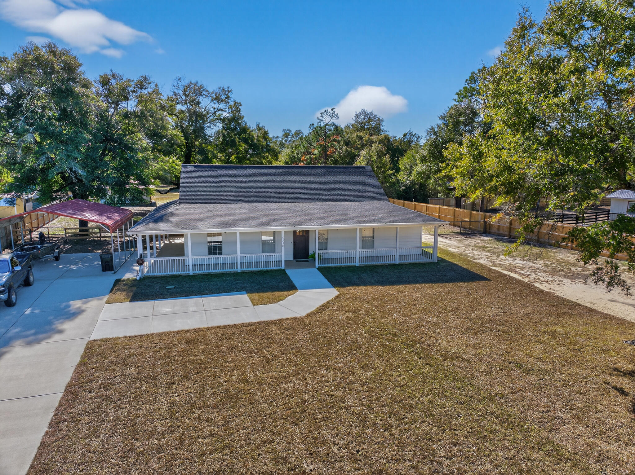 ** MULTIPLE OFFERS RECEIVED! HIGHEST AND BEST OFFERS DUE BY JANUARY 2ND AT 12 PM.**  STOP THE CAR! This is the one you've been waiting for.

This beautifully renovated, custom-built home sits on 1.22 acres of peaceful, versatile land, offering space to spread out and endless possibilities. Start your mornings with coffee on the wraparound porch and unwind in the evenings as the sun sets from the covered back porch; the perfect backdrop for everyday living or entertaining.

Step inside to a bright, welcoming main living area featuring soaring ceilings, fresh paint, and new LVP flooring throughout the main spaces.  The open flow leads seamlessly into the dining area and kitchen, where stainless steel appliances, granite countertops, and abundant cabinetry create a functional yet stylish heart of the home. The generously sized primary suite is thoughtfully positioned just off the kitchen and offers new carpet, a tray ceiling, and a spacious walk-in closet. The ensuite bath is equally impressive, featuring a double vanity, walk-in shower, and a second walk-in closet with custom built-in shelving.

A split floor plan provides privacy, with two additional well-sized bedrooms and a fully updated guest bathroom located on the opposite side of the home.

Outside, enjoy an expansive fenced backyard complete with a detached garage with roll-up door and a separate carport; ideal for vehicles, hobbies, or storage. Major updates include a new roof and hot water heater in 2024, offering peace of mind for years to come.

This move-in-ready home blends comfort, functionality, and space; all in a serene setting you'll love coming home to.