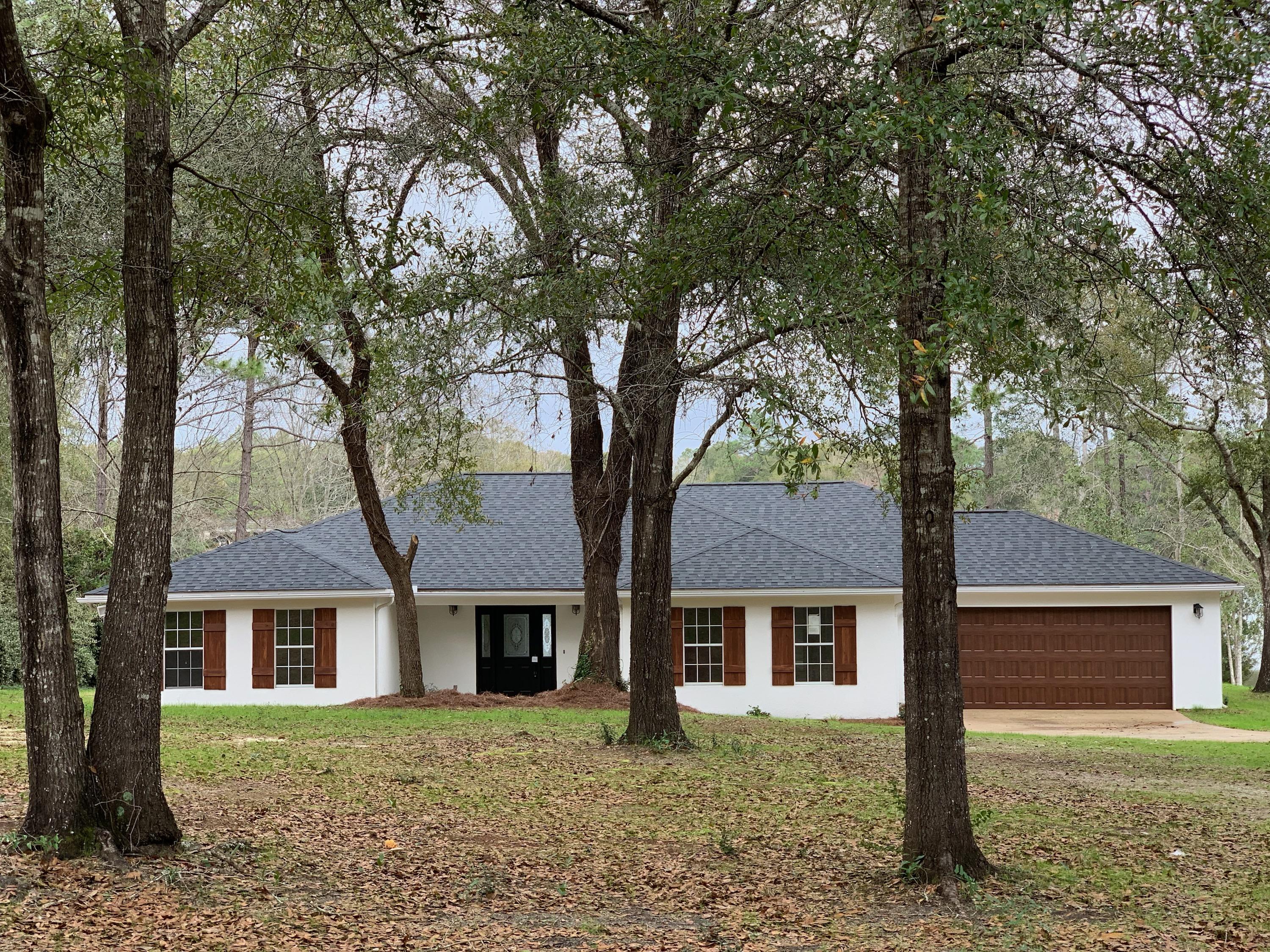 Rare find on the water!!! This beautiful home is located right in the heart of Crestview. Have your morning coffee in the breakfast area, deck, or on the dock while overlooking the lake. Home sits on a little over 3/4 acre with plenty of room to enjoy the peace and quiet. This is truly a rare find for our area. Home has been completely updated with a new roof, paint, flooring, kitchen cabinets, appliances, trim, bathroom cabinets, sinks, fixtures, garden tub, tile shower, dock, garage door, and much more. See to believe! Schedule your showing today!