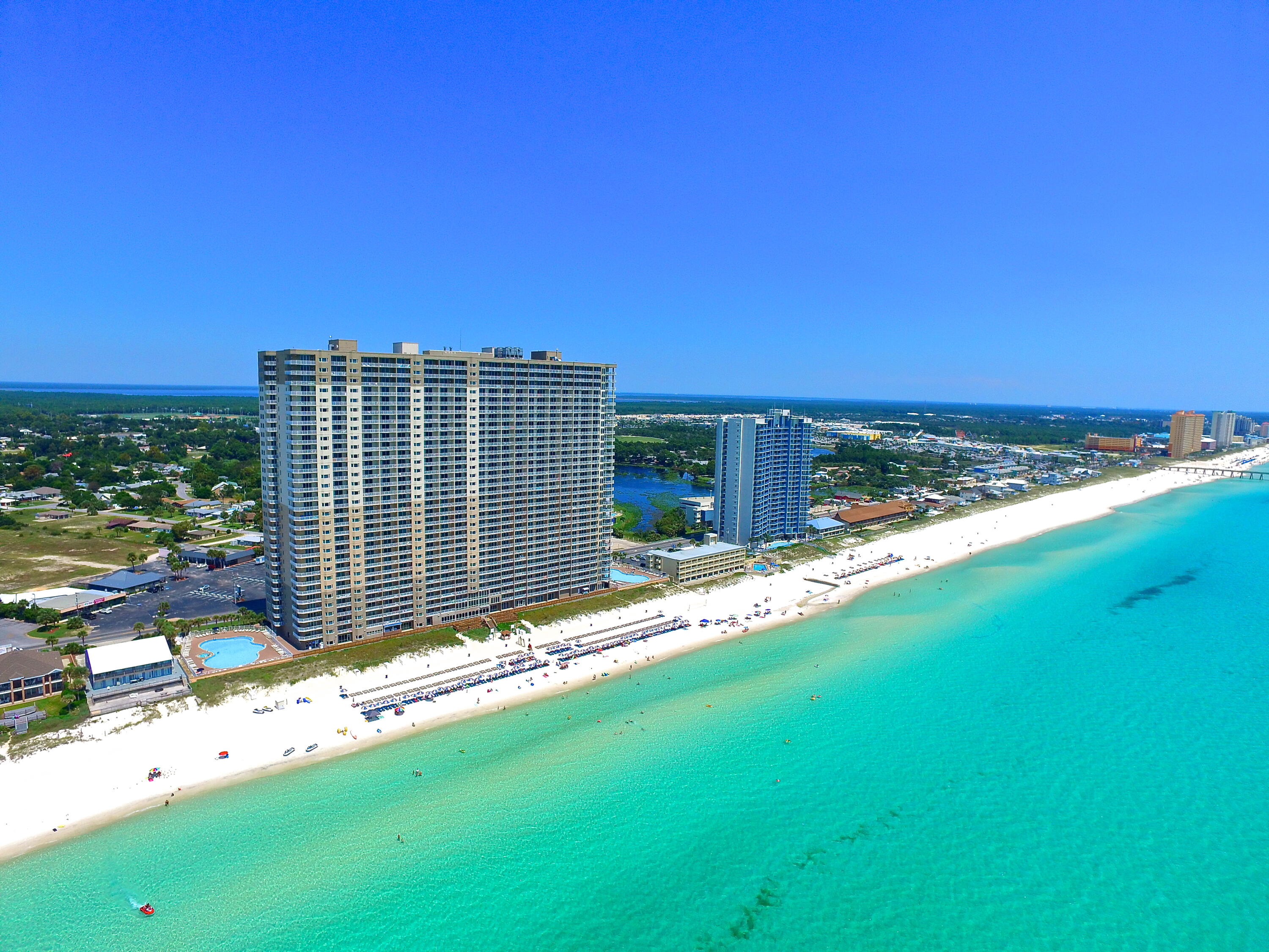 **GROUND FLOOR, BEACH FRONT, WALK STRAIGHT OUT TO THE BEACH OFF THE PATIO, INCREDIBLE VIEWS, TWO BEDROOM PLUS BUNK AREA, 3 FULL BATHROOMS, 12 FOOT CEILINGS, TWO EXTERIOR STORAGE CLOSETS** Tidewater Condo #10 offers 2 bedrooms plus a bunk area and 3 full bathrooms on a penthouse level with unparalleled Gulf views from the living, kitchen and balcony areas. This condo is a consistent rental income generator with a solid history and future rentals that can convey if staying with the same rental manager. The condo is sold fully furnished and decorated making for a turn key situation for the new owner. The ''M'' floorplan at Tidewater is very unique to the market offering sleeping for 8 and having the 3 full bathrooms.