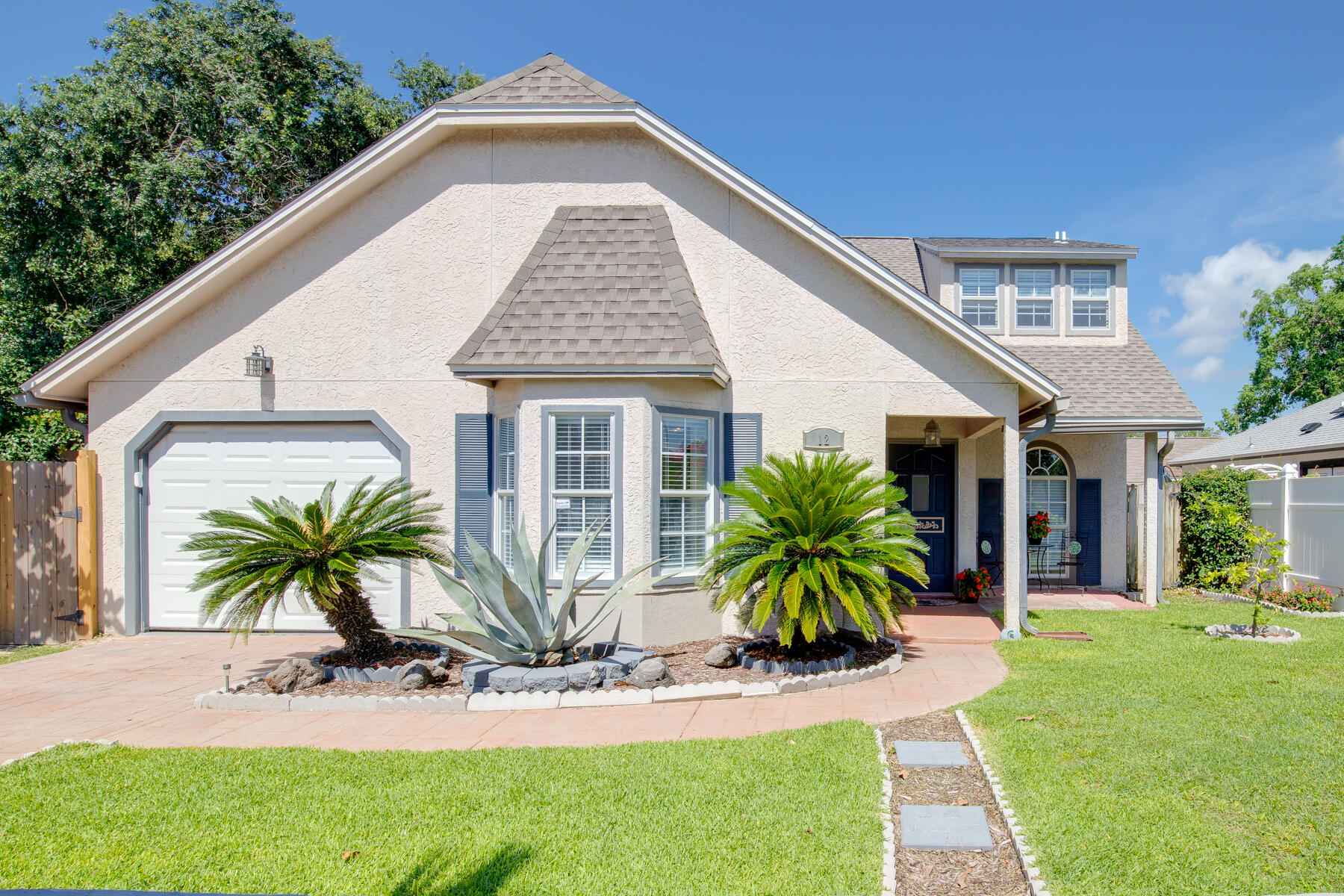 French provincial architecture meets beach living in the heart of Destin at this 2 story 3 bedroom home with spacious living areas. Master bedroom is downstairs while additional bedrooms are located upstairs with their own bonus living space. The backyard deck is spacious enough to accommodate outdoor grilling, dining, and entertaining. The interior was recently treated to fresh bright paint. 2 year old roof includes a solar panel system that has offset the owner's electric bill.