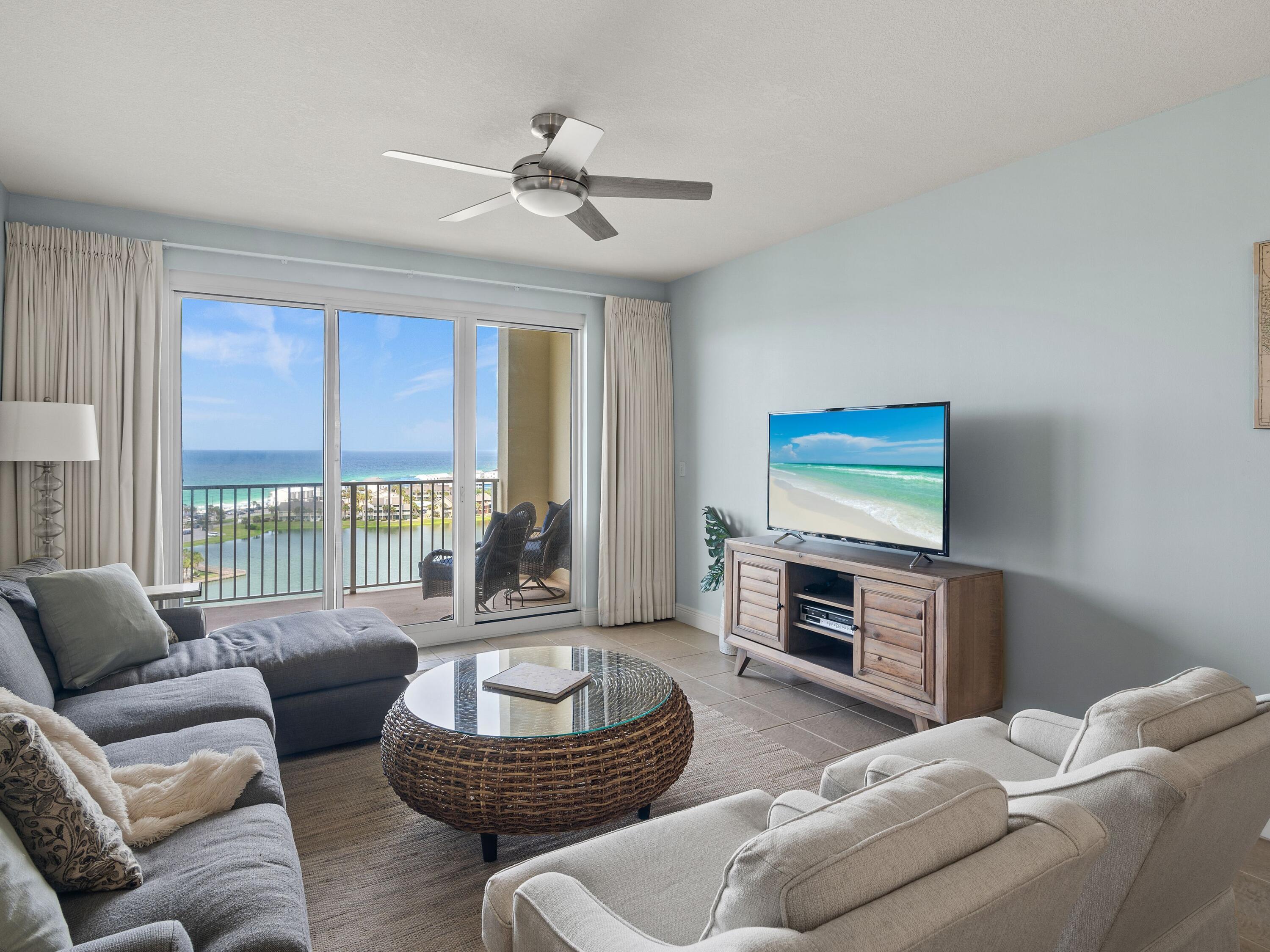 Welcome to Ariel Dunes II, where a beautifully appointed high-floor condo in the gated resort community of Seascape awaits. This charming unit has an Icon 6-seater golf cart that can be negotiated with the sale.  Currently used only as a second home, this unit offers an ideal opportunity for those seeking a rental investment or a personal vacation haven with views of both a lake and the Gulf of Mexico. Step into this elegant condo with tile flooring and a modern kitchen with stainless steel appliances which were replaced in 2017. Recent updates include a new water heater in 2022 and an HVAC unit installed in 2020, ensuring comfort and reliability. This condo offers stunning views and easy access to all the attractions and conveniences of the area, as well as an array of exceptional amenities, including three sparkling pools, a state-of-the-art fitness center, three clay pickleball courts, six clay tennis courts, and a basketball court. Enjoy 2,000 feet of pristine beach frontage for a day of sun and surf. As an added bonus, owners in Ariel Dunes II have access to five additional pools within the Seascape community. Whether you are relaxing on the balcony, taking a dip in one of the pools, or enjoying a game of tennis or pickleball, Ariel Dunes II is ready to welcome you home to the beach lifestyle you've always dreamed of.
